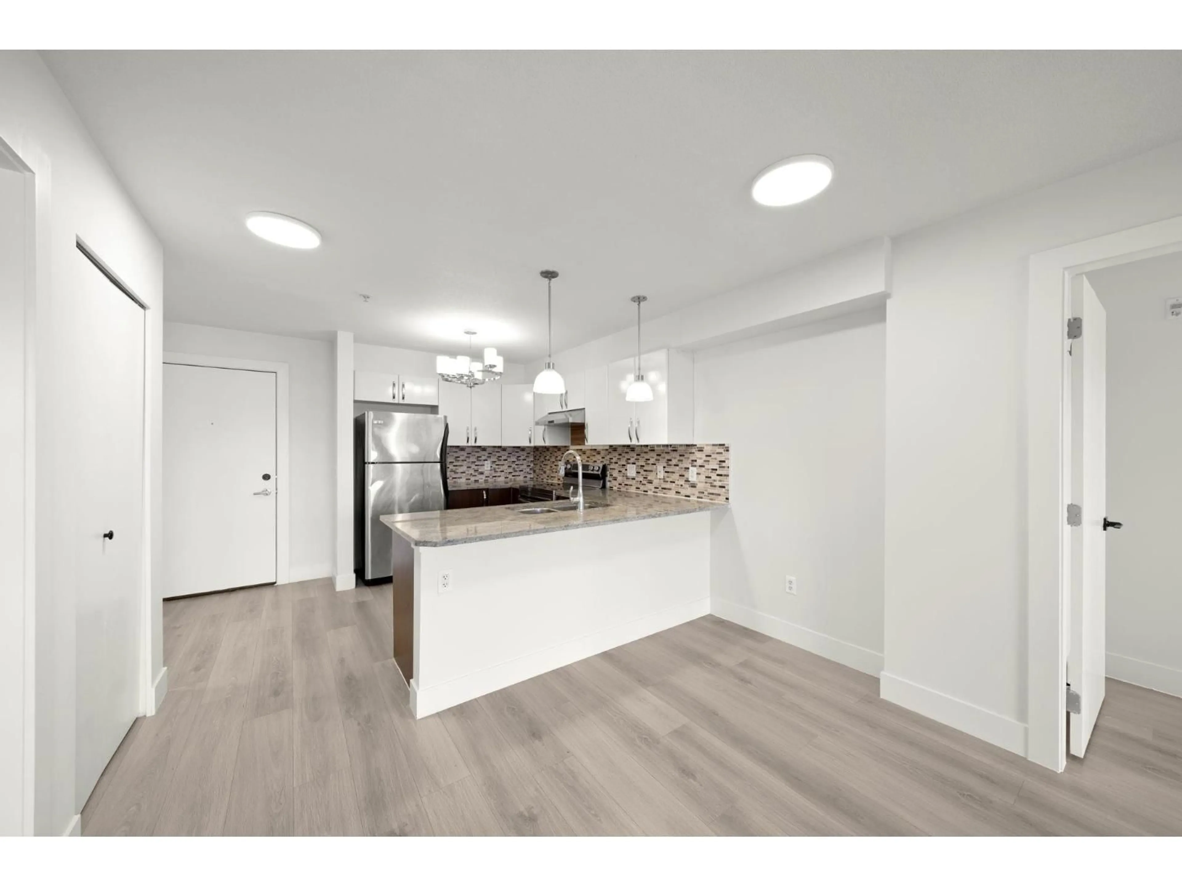 Open concept kitchen, unknown for 318 - 13555 GATEWAY DRIVE, Surrey British Columbia V3T0B5