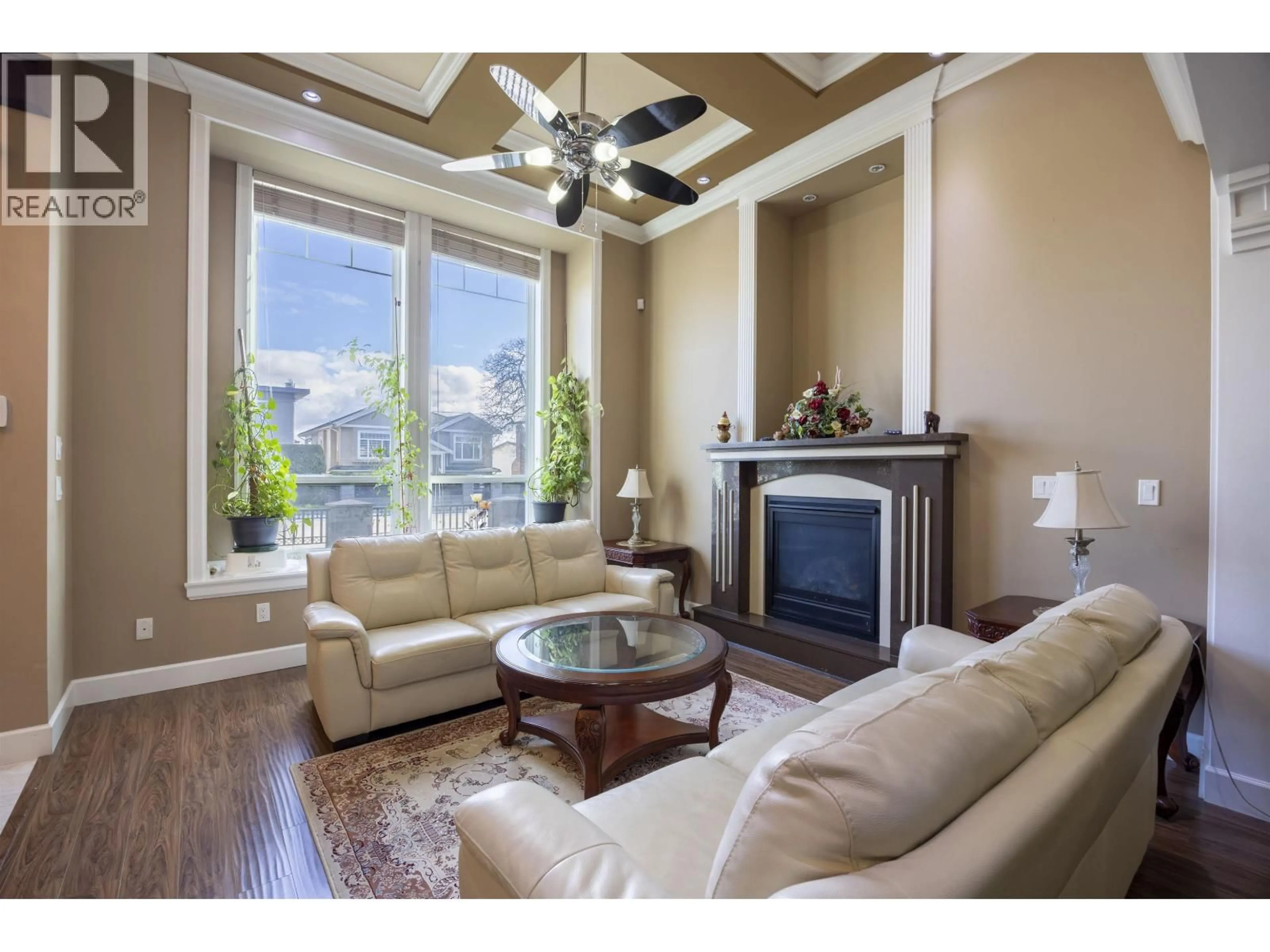 Living room with furniture, wood/laminate floor for 7851 CANADA WAY, Burnaby British Columbia V3N3K8