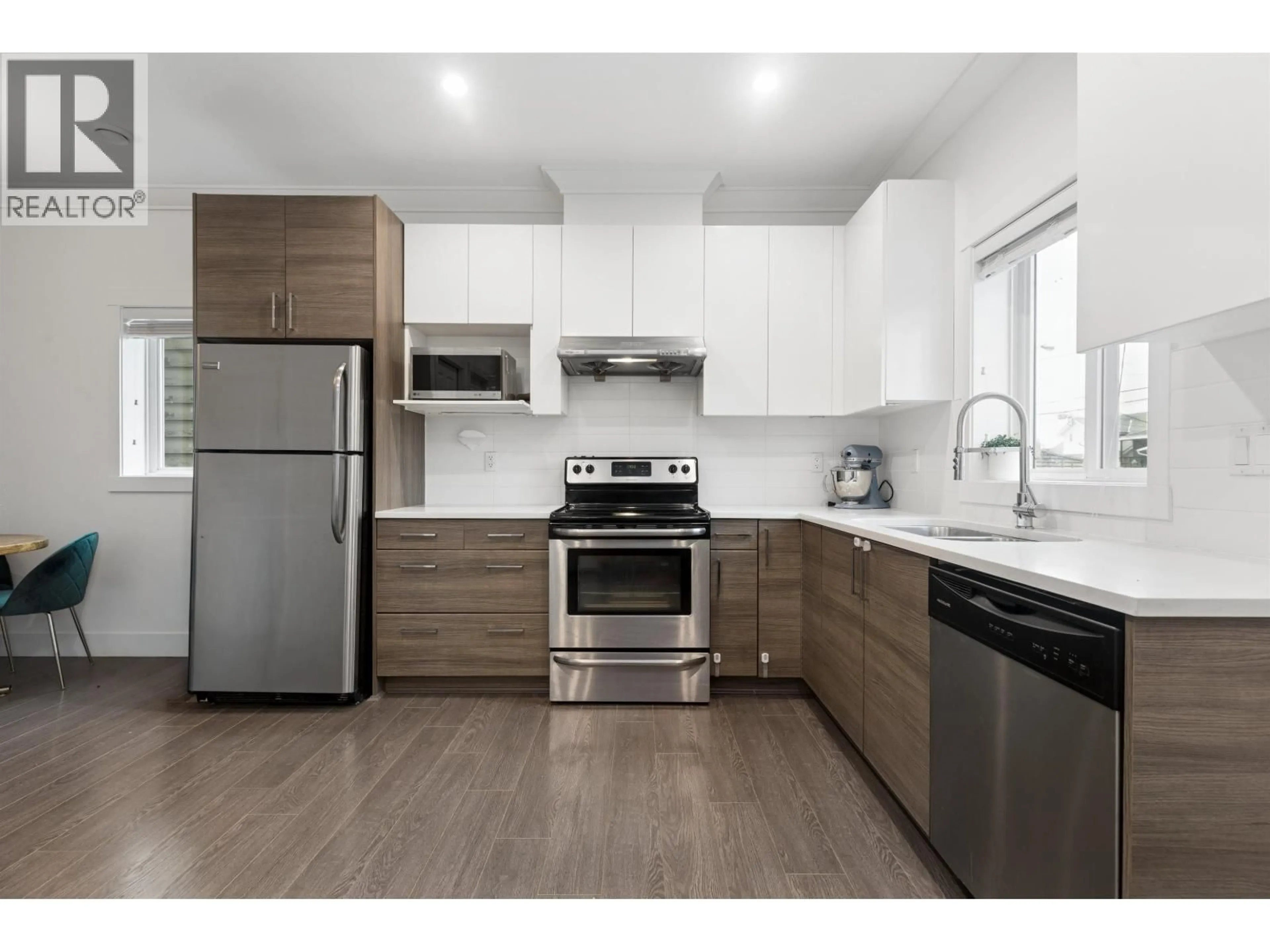 Open concept kitchen, wood/laminate floor for 2275 34TH AVENUE, Vancouver British Columbia V5P1A9