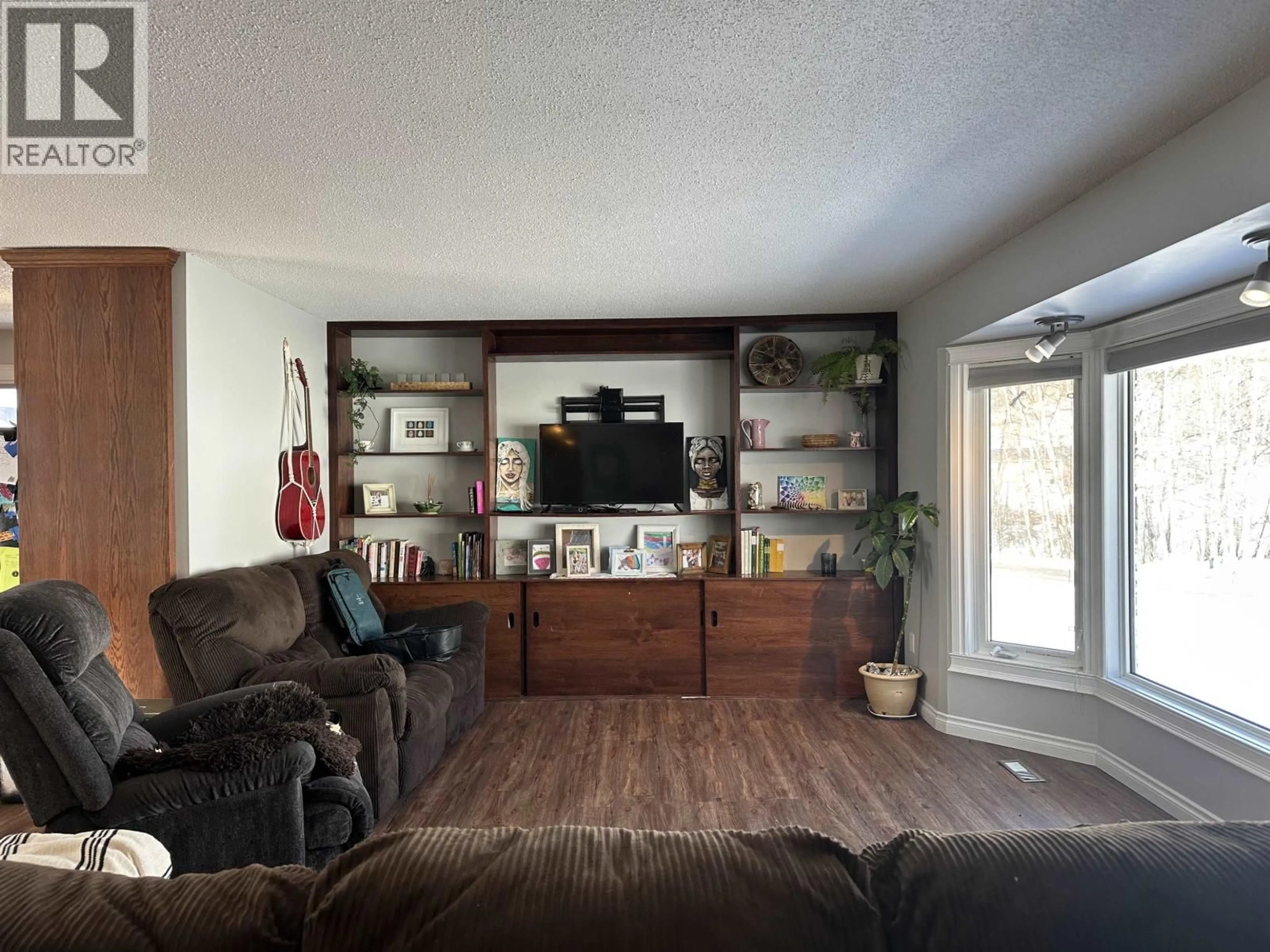 Living room with furniture, wood/laminate floor for 9405 RIVER DRIVE, Fort St. John British Columbia V1J4M7