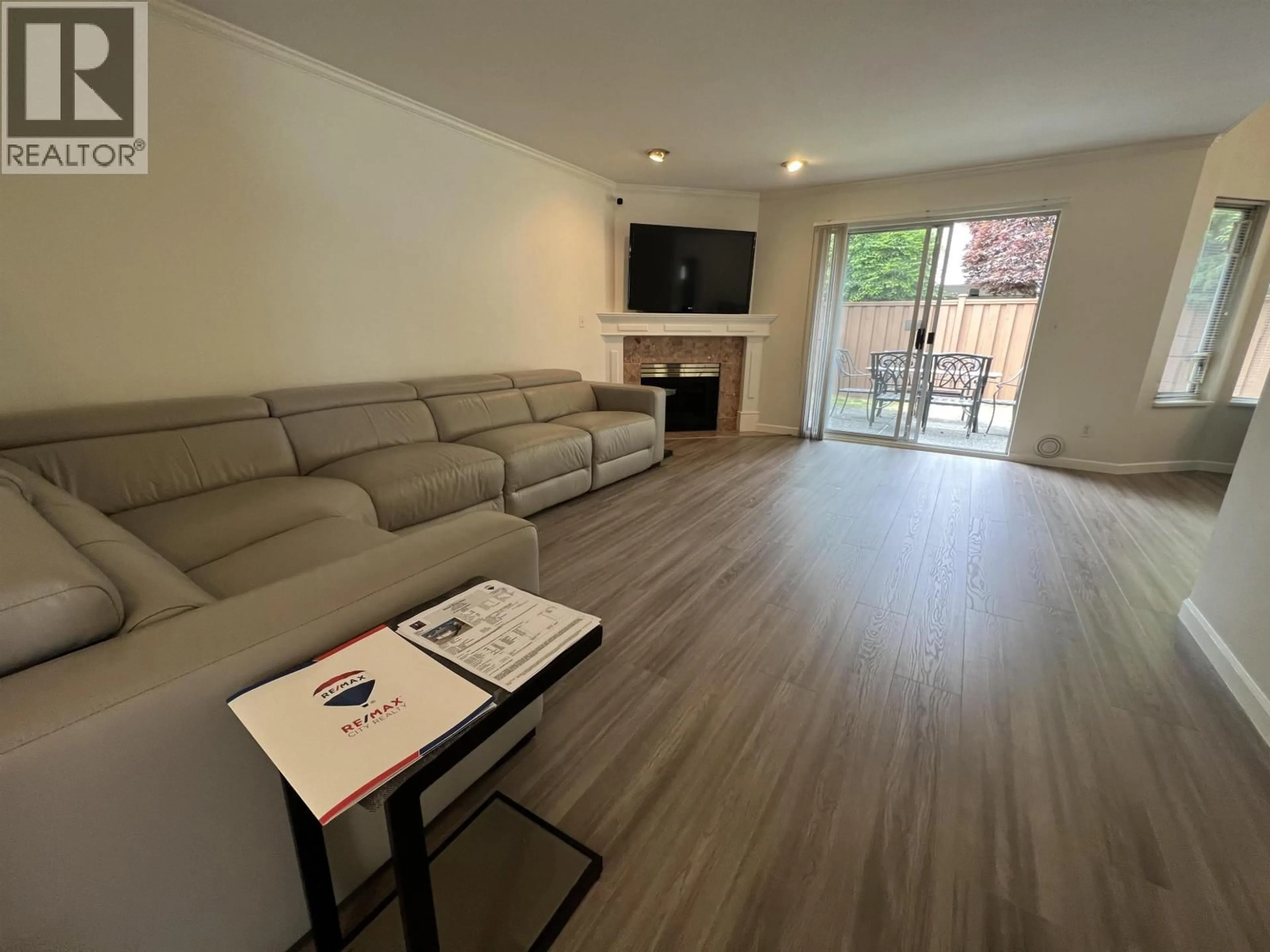 Living room with furniture, wood/laminate floor for 34 - 8051 ASH STREET, Richmond British Columbia V6Y3X6