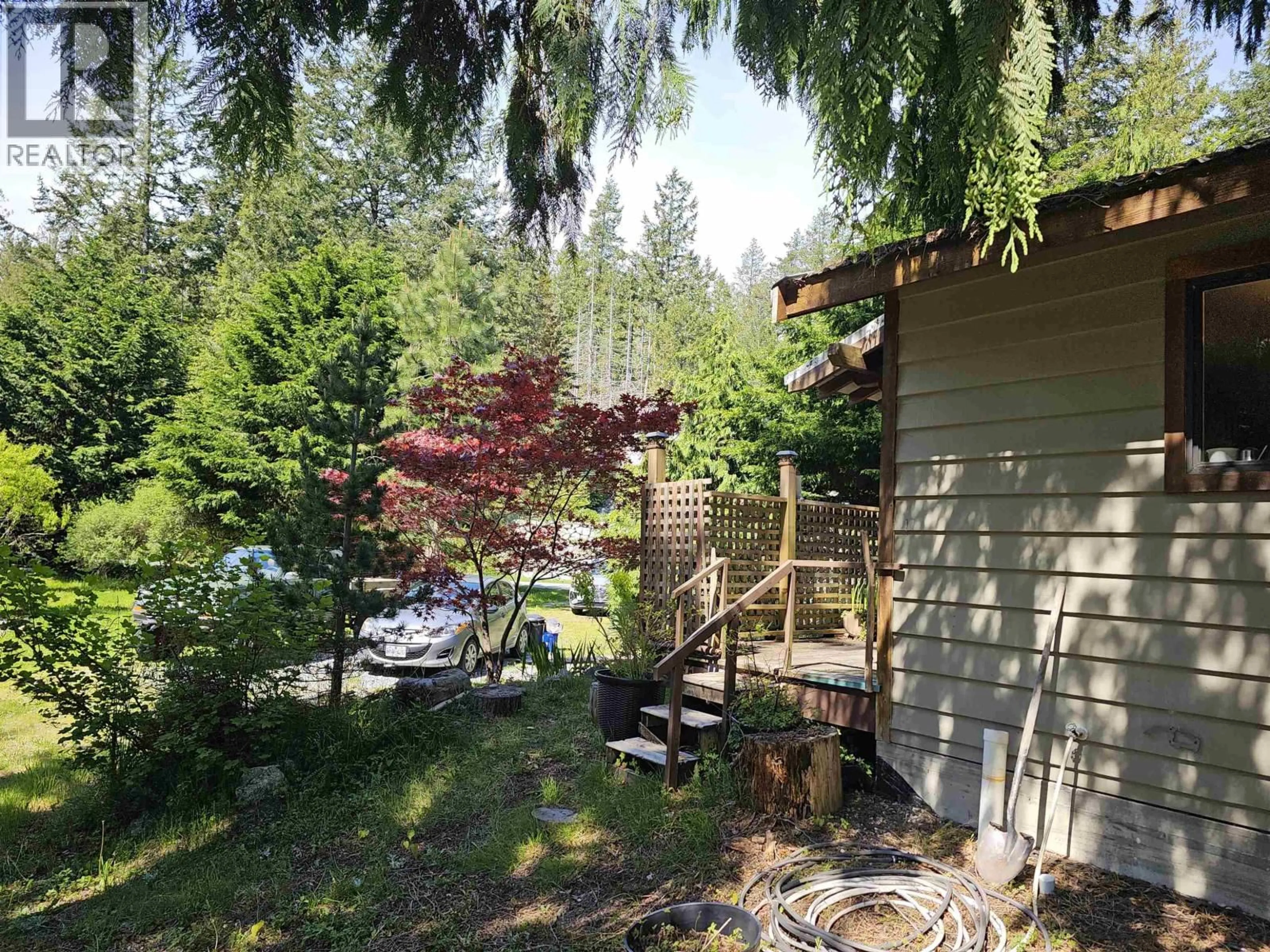 A pic from outside/outdoor area/front of a property/back of a property/a pic from drone, forest/trees view for 12649 MERRILL CRESCENT, Pender Harbour British Columbia V0N2H1