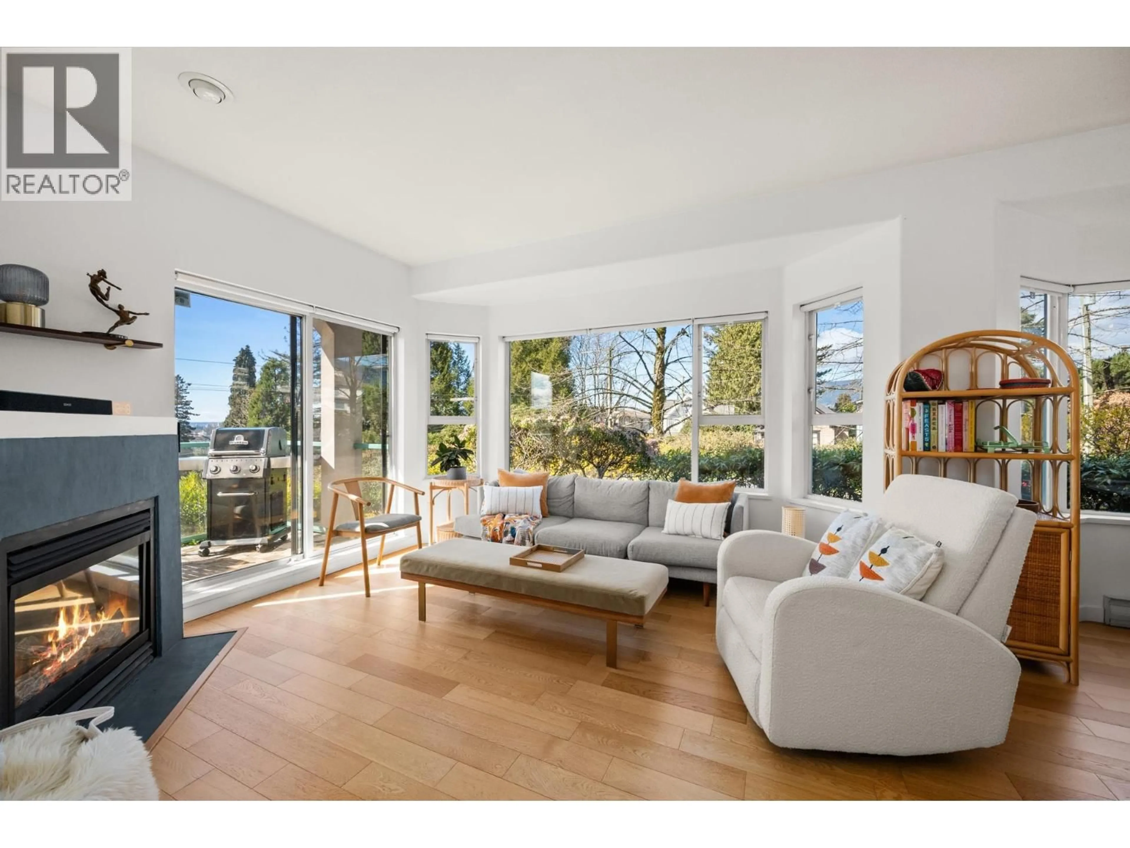 Living room with furniture, wood/laminate floor for 103 - 177 5TH STREET, North Vancouver British Columbia V7M1J6