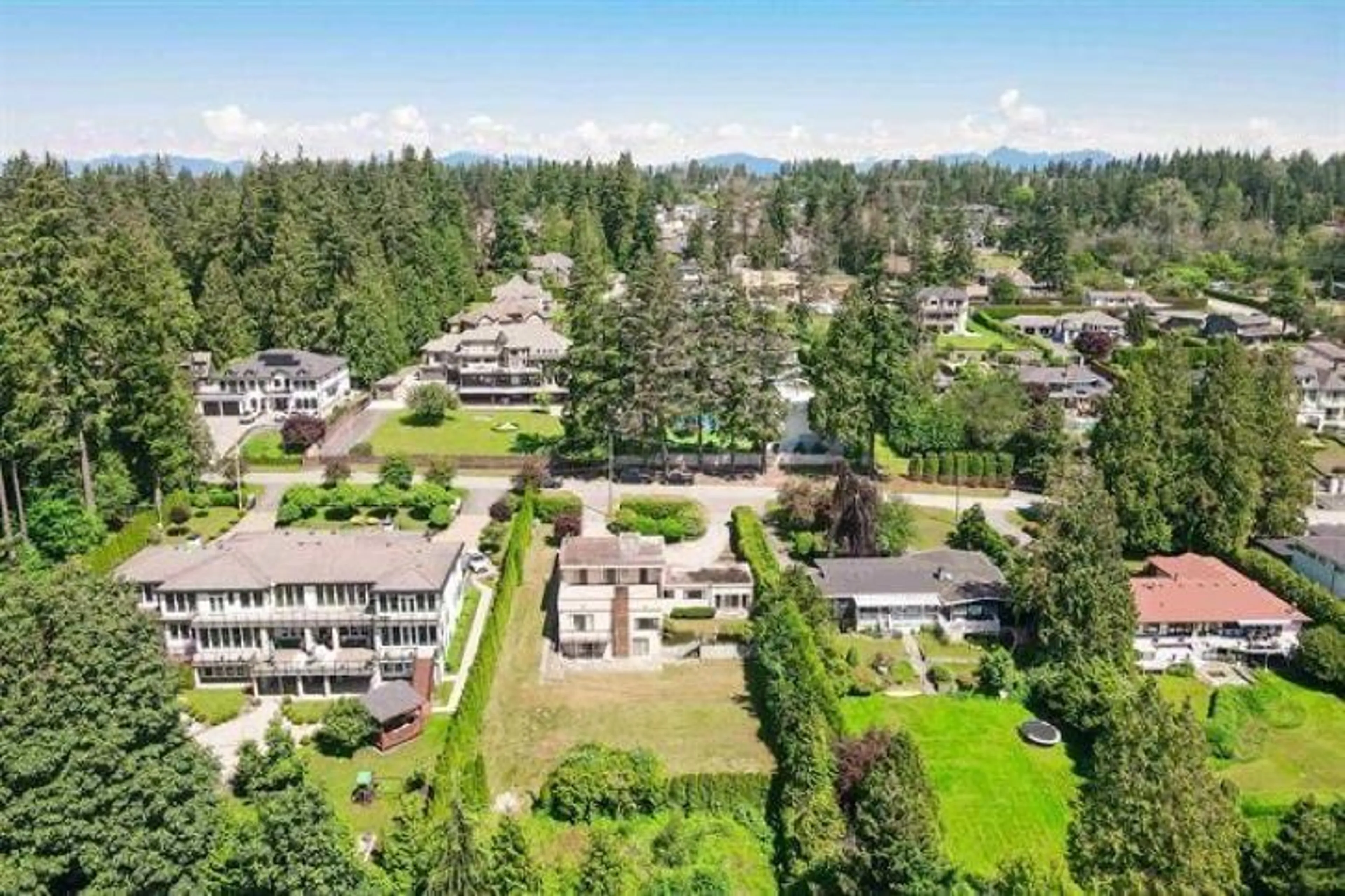 A pic from outside/outdoor area/front of a property/back of a property/a pic from drone, mountain view for 12710 54 AVENUE, Surrey British Columbia V3X3C2
