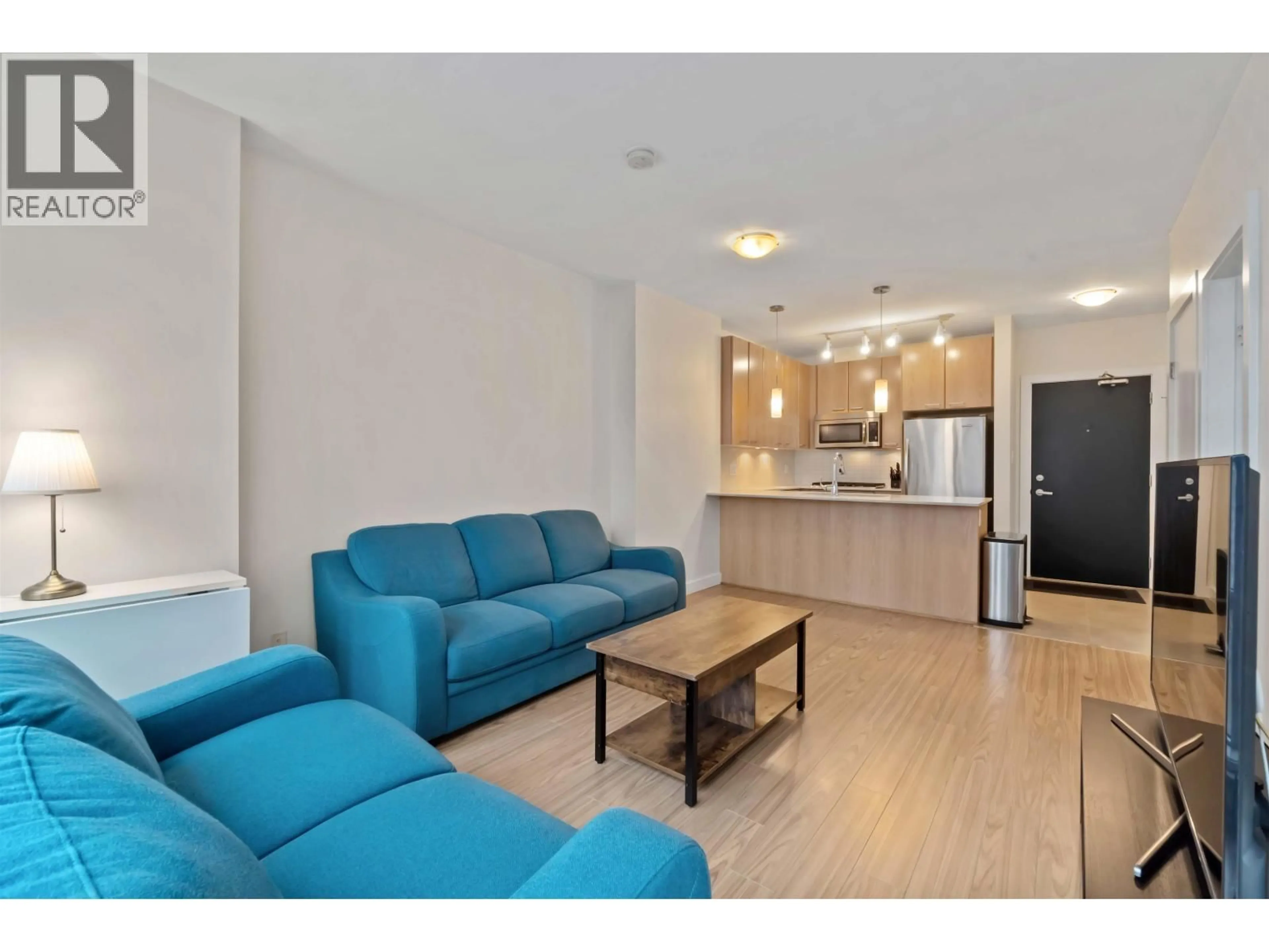 Living room with furniture, wood/laminate floor for 1603 - 2955 ATLANTIC AVENUE, Coquitlam British Columbia V3B0H9