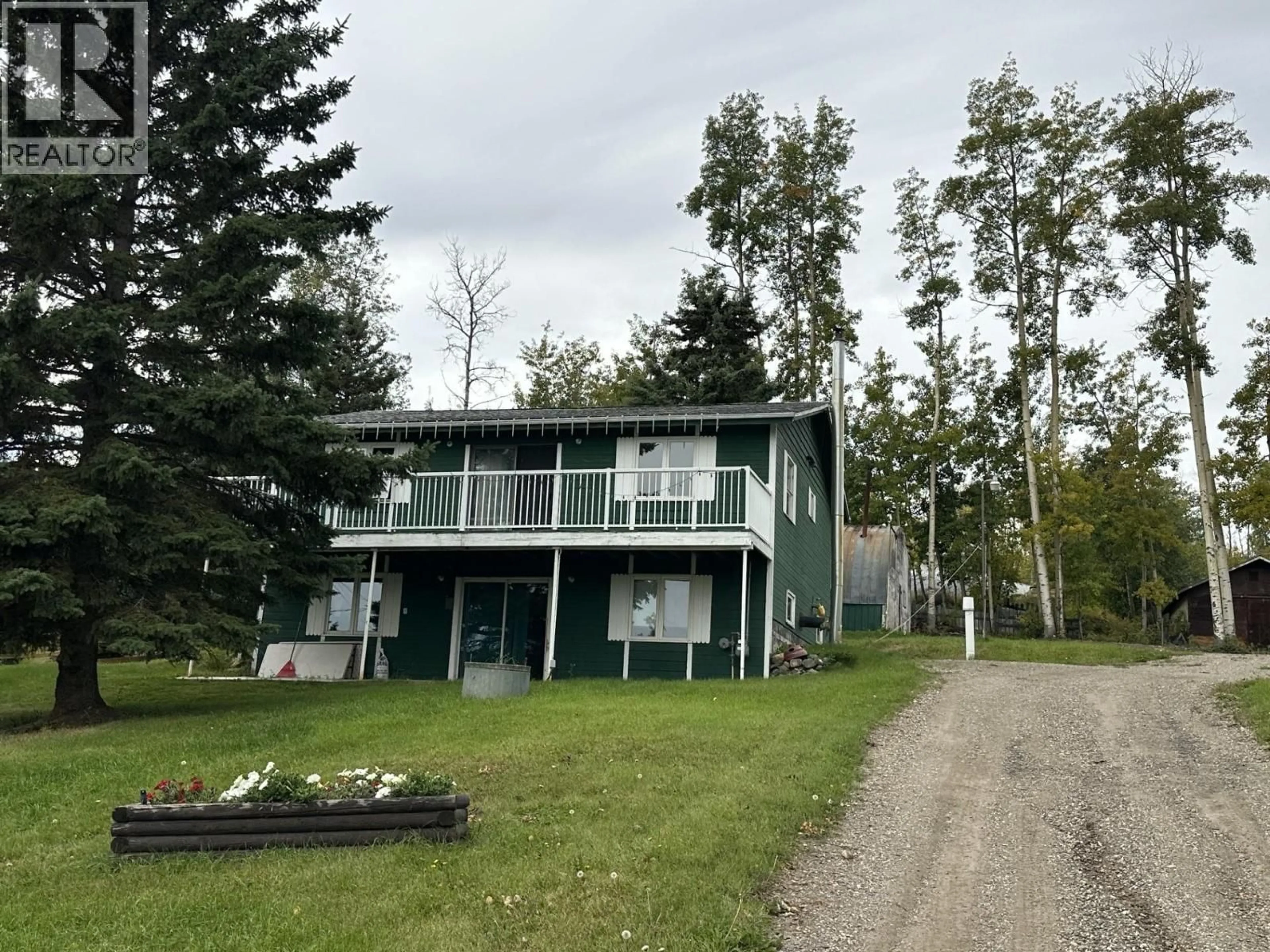 A pic from outside/outdoor area/front of a property/back of a property/a pic from drone, water/lake/river/ocean view for 13235 LAKESHORE DRIVE, Charlie Lake British Columbia V1J8G1