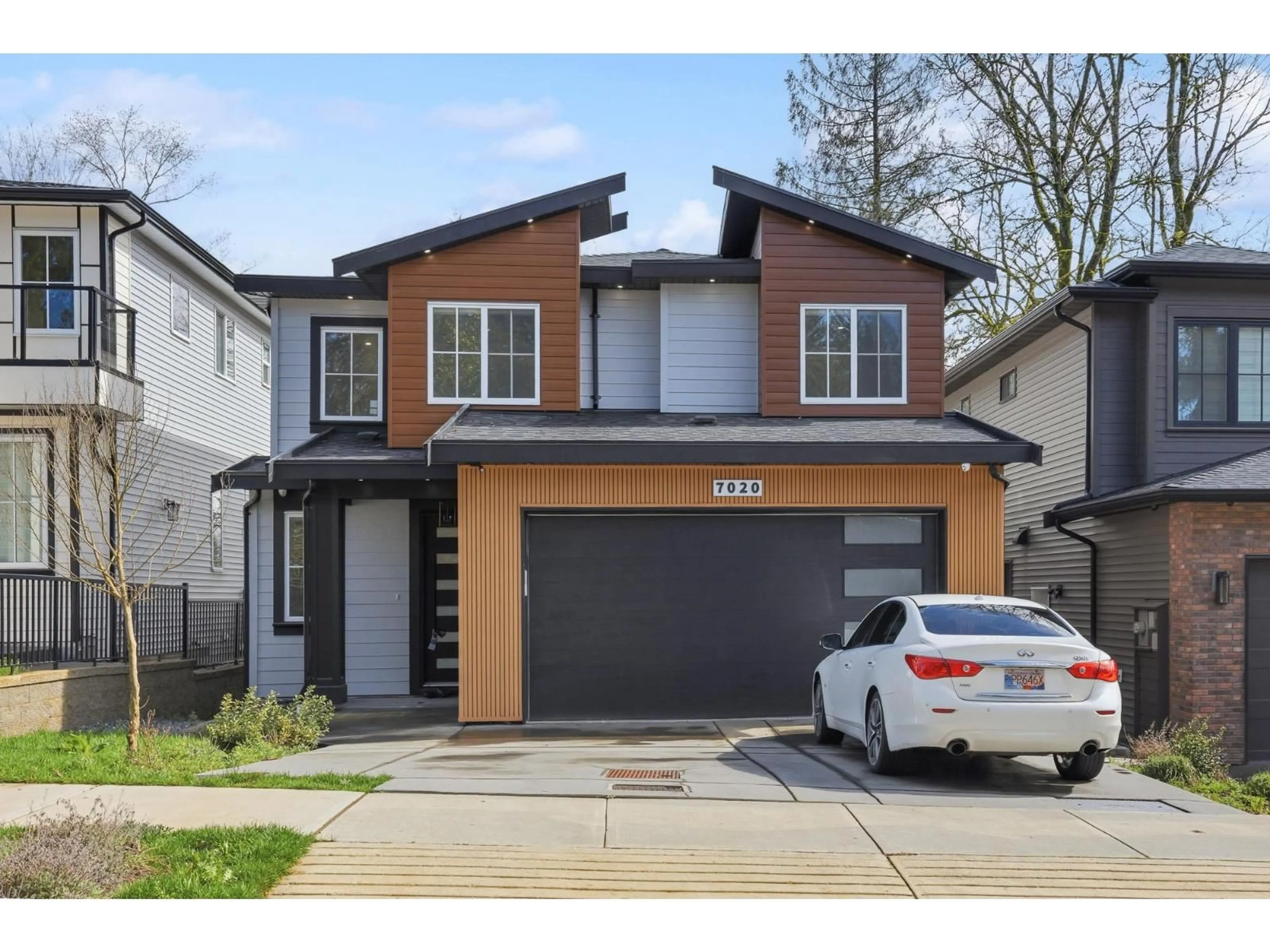 Home with brick exterior material, street for 7020 205 STREET, Langley British Columbia V2Y1S9