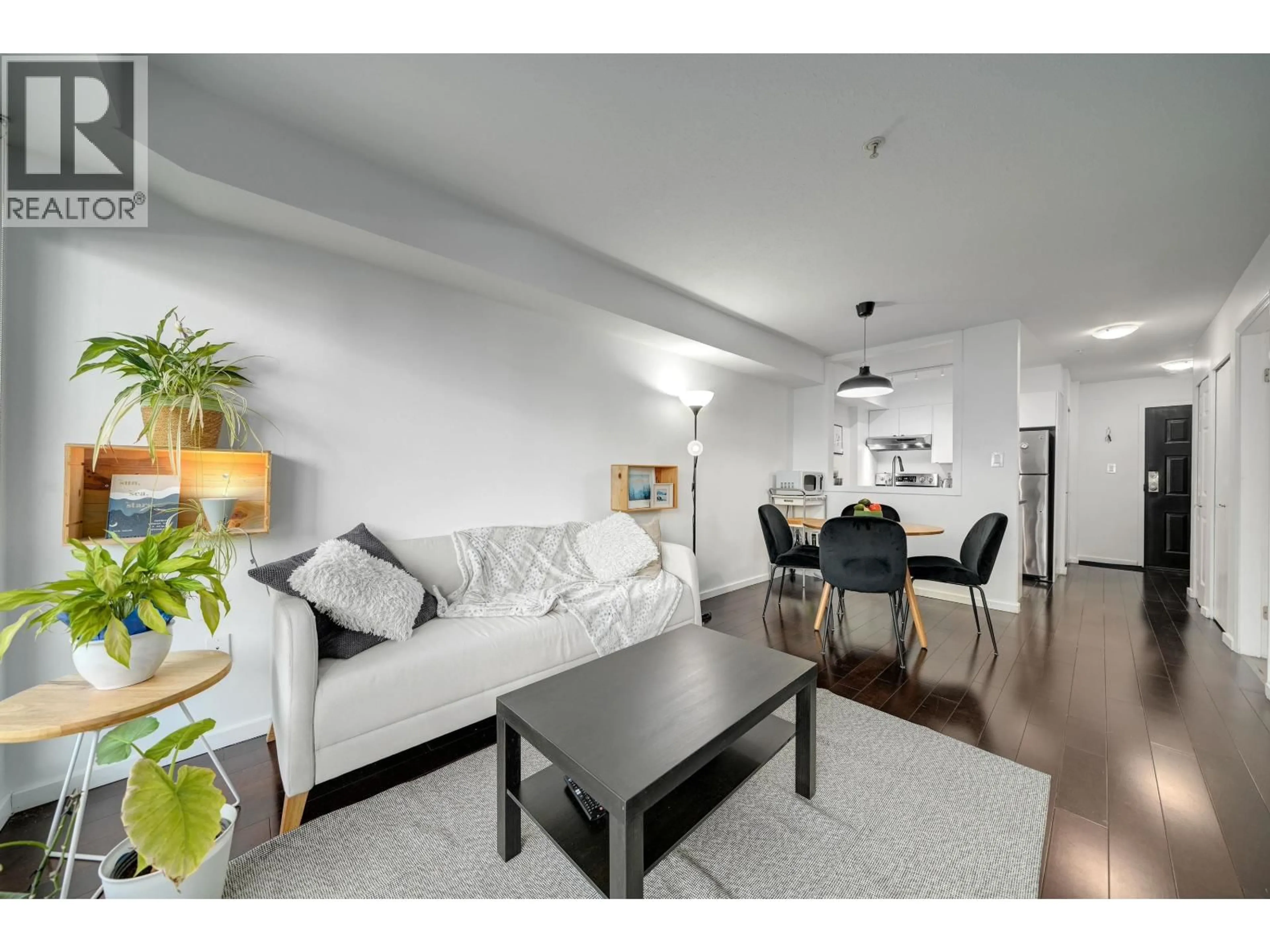 Living room with furniture, wood/laminate floor for 210 - 1099 BROADWAY, Vancouver British Columbia V5T1Y5