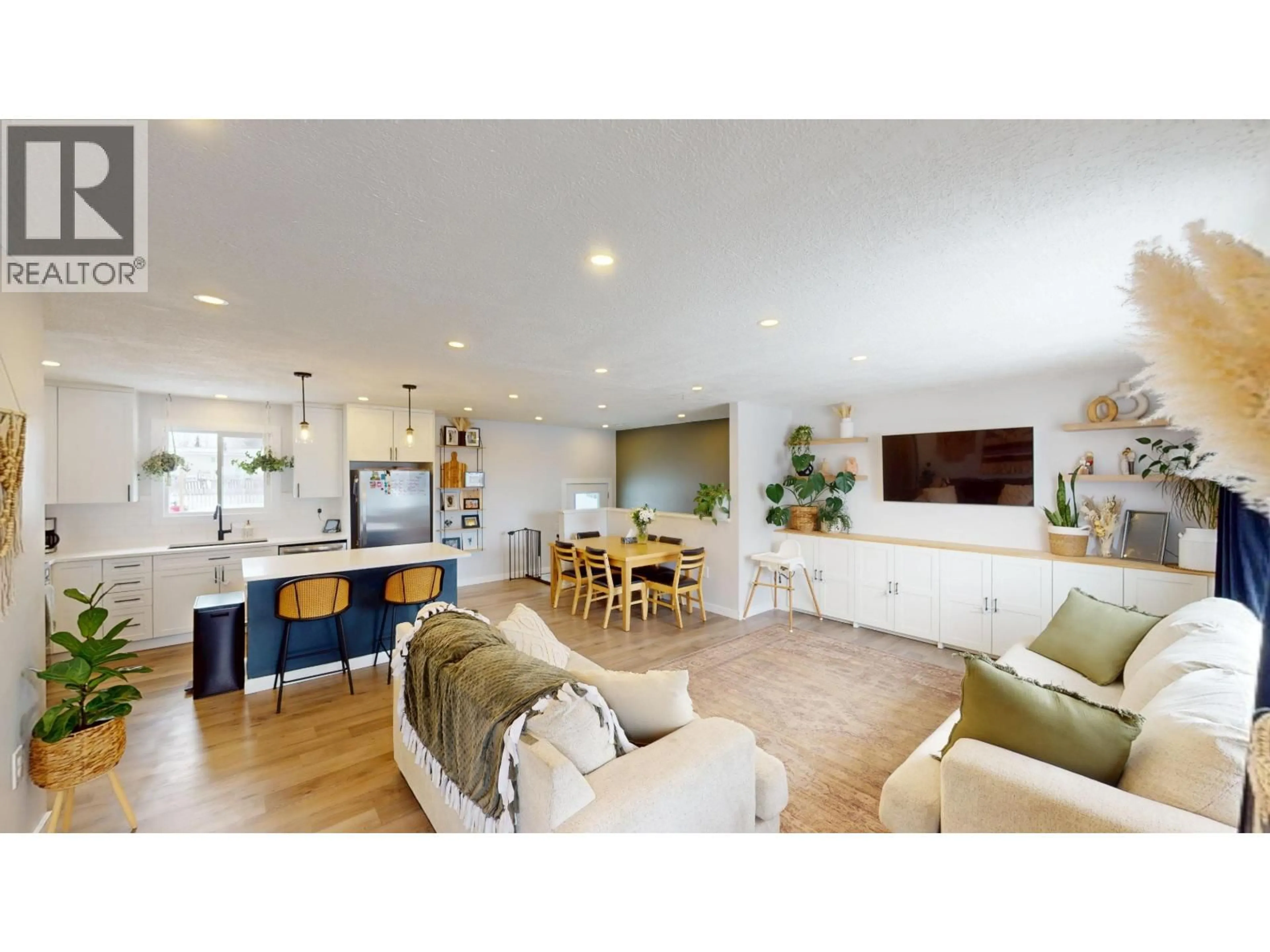 Open concept kitchen, wood/laminate floor for 9811 112 AVENUE, Fort St. John British Columbia V1J2W4