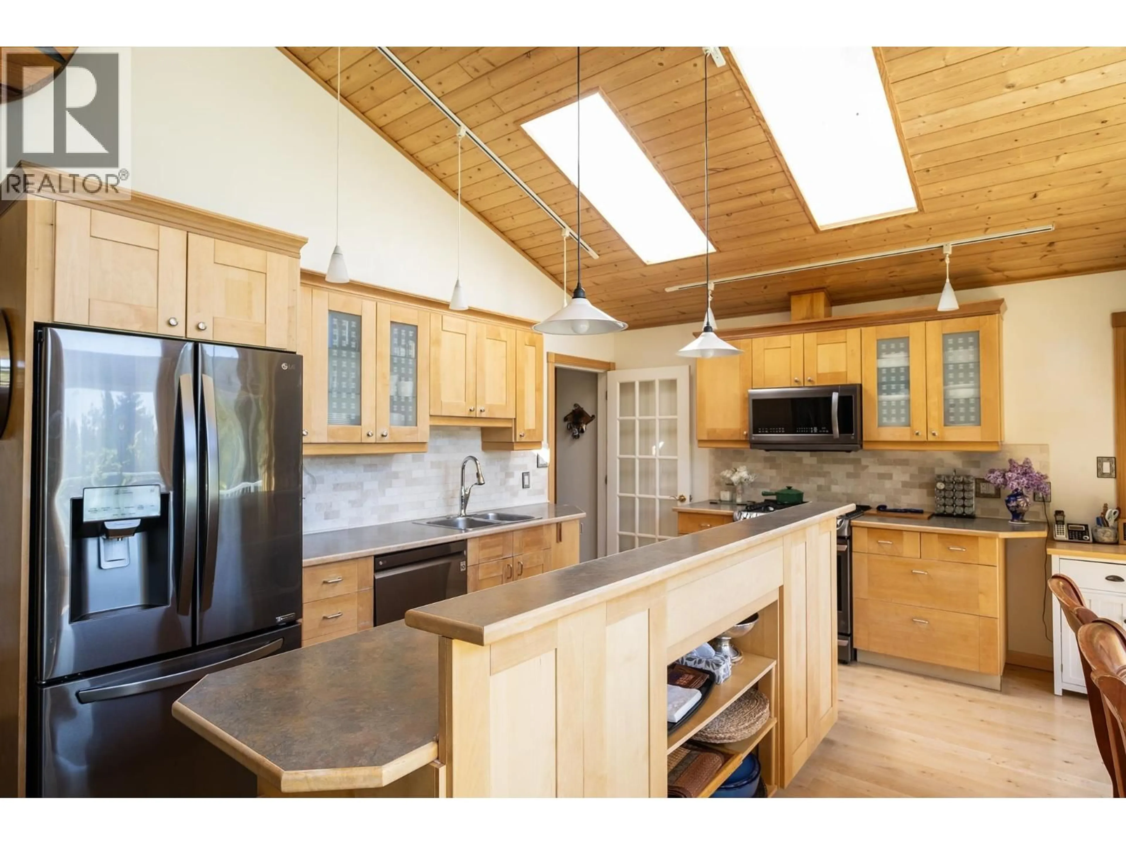 Open concept kitchen, wood/laminate floor for 2556 LOWER ROAD, Roberts Creek British Columbia V0N2W4