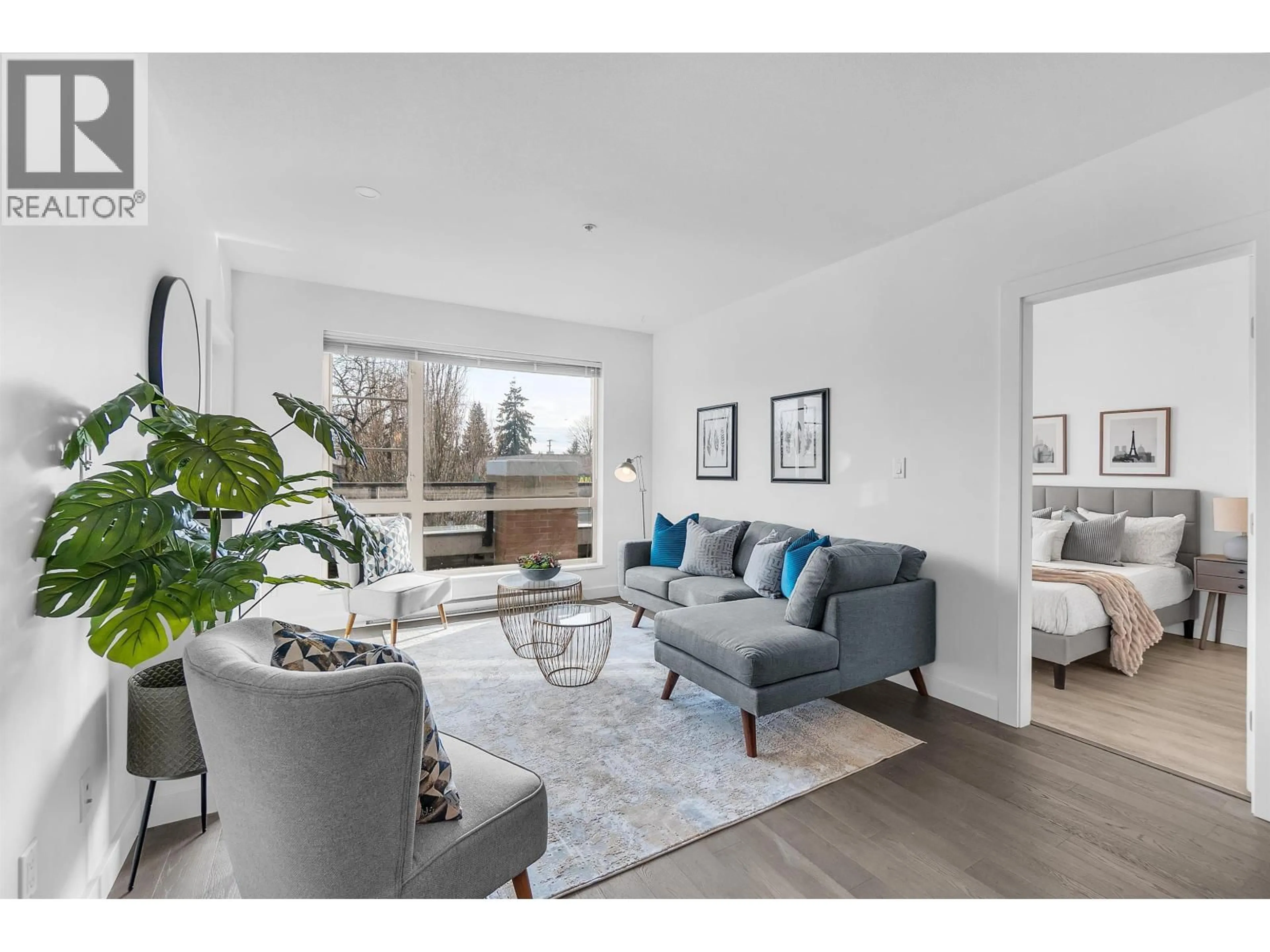 Living room with furniture, wood/laminate floor for 202 - 1330 MARINE DRIVE, North Vancouver British Columbia V7P1T4