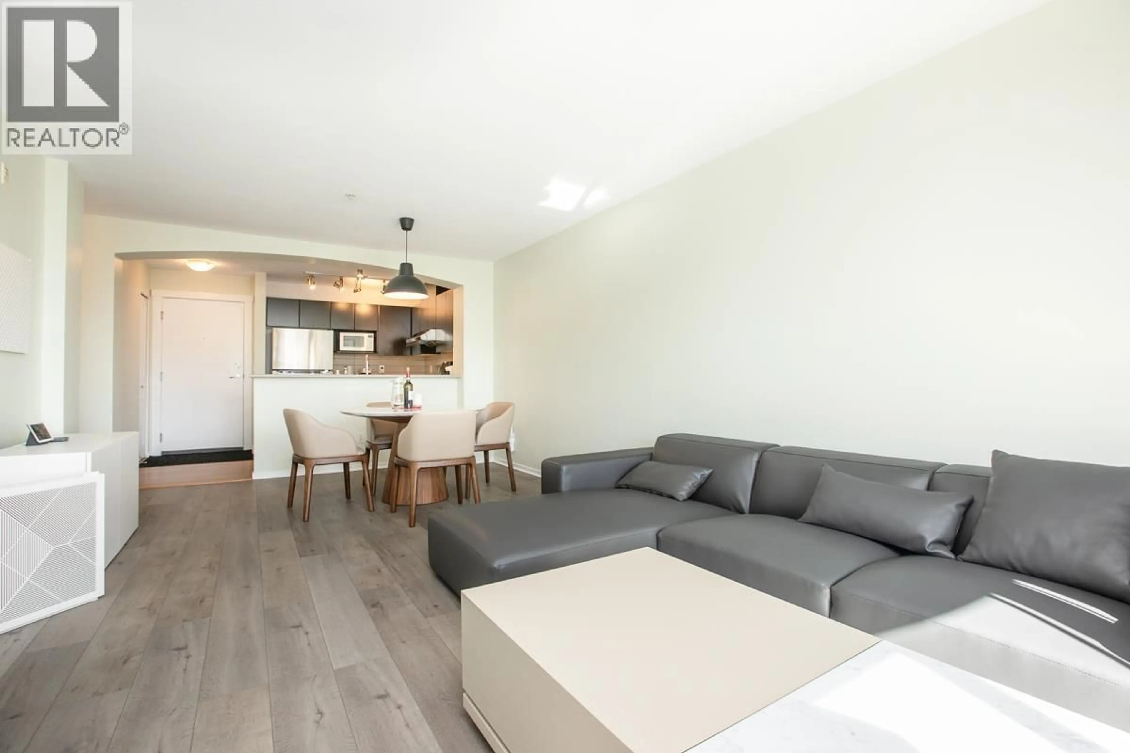 Living room with furniture, wood/laminate floor for 401 - 9319 UNIVERSITY CRESCENT, Burnaby British Columbia V5A4Y5