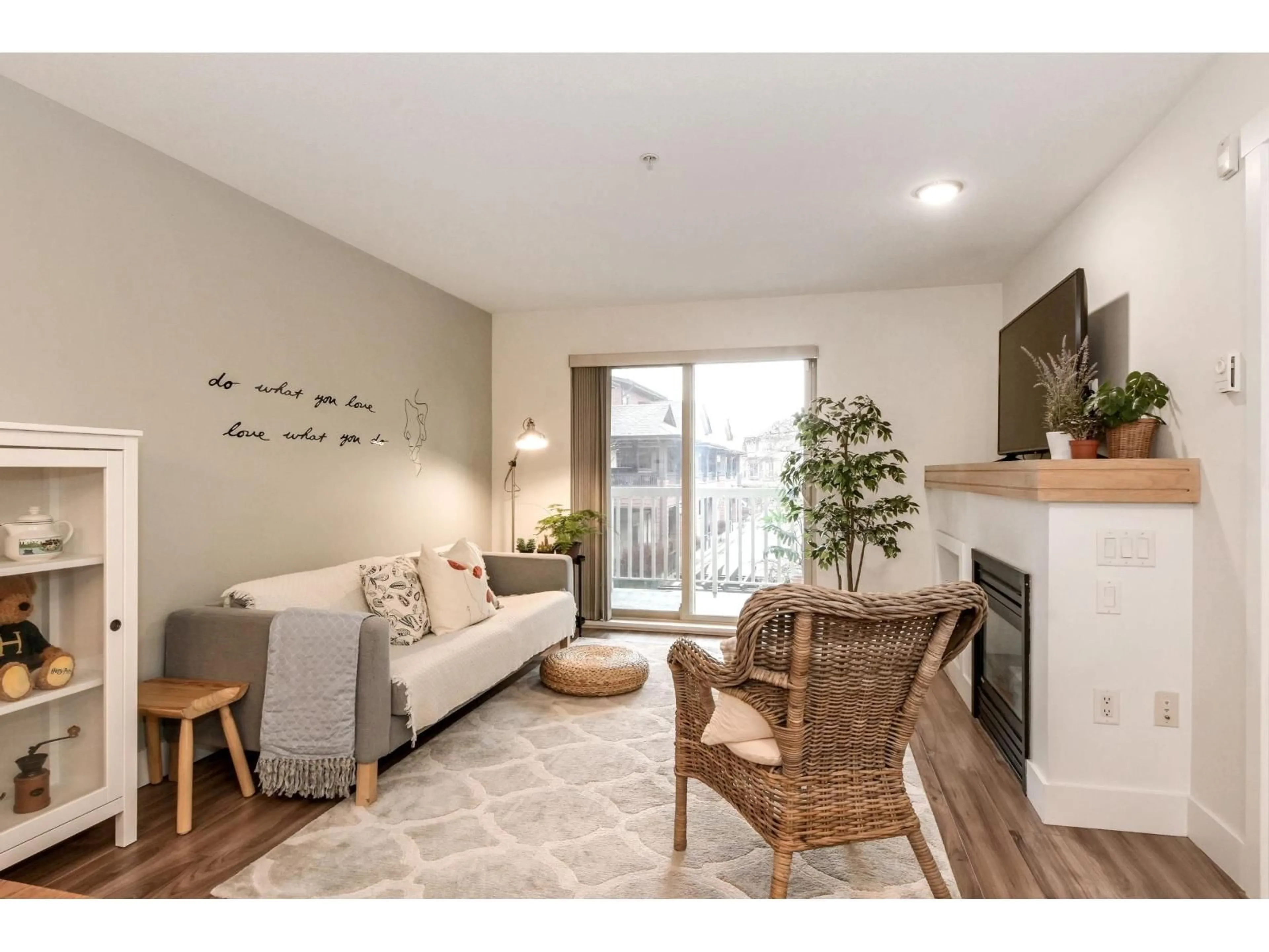 Living room with furniture, wood/laminate floor for 205 - 6500 194 STREET, Surrey British Columbia V4N5X4