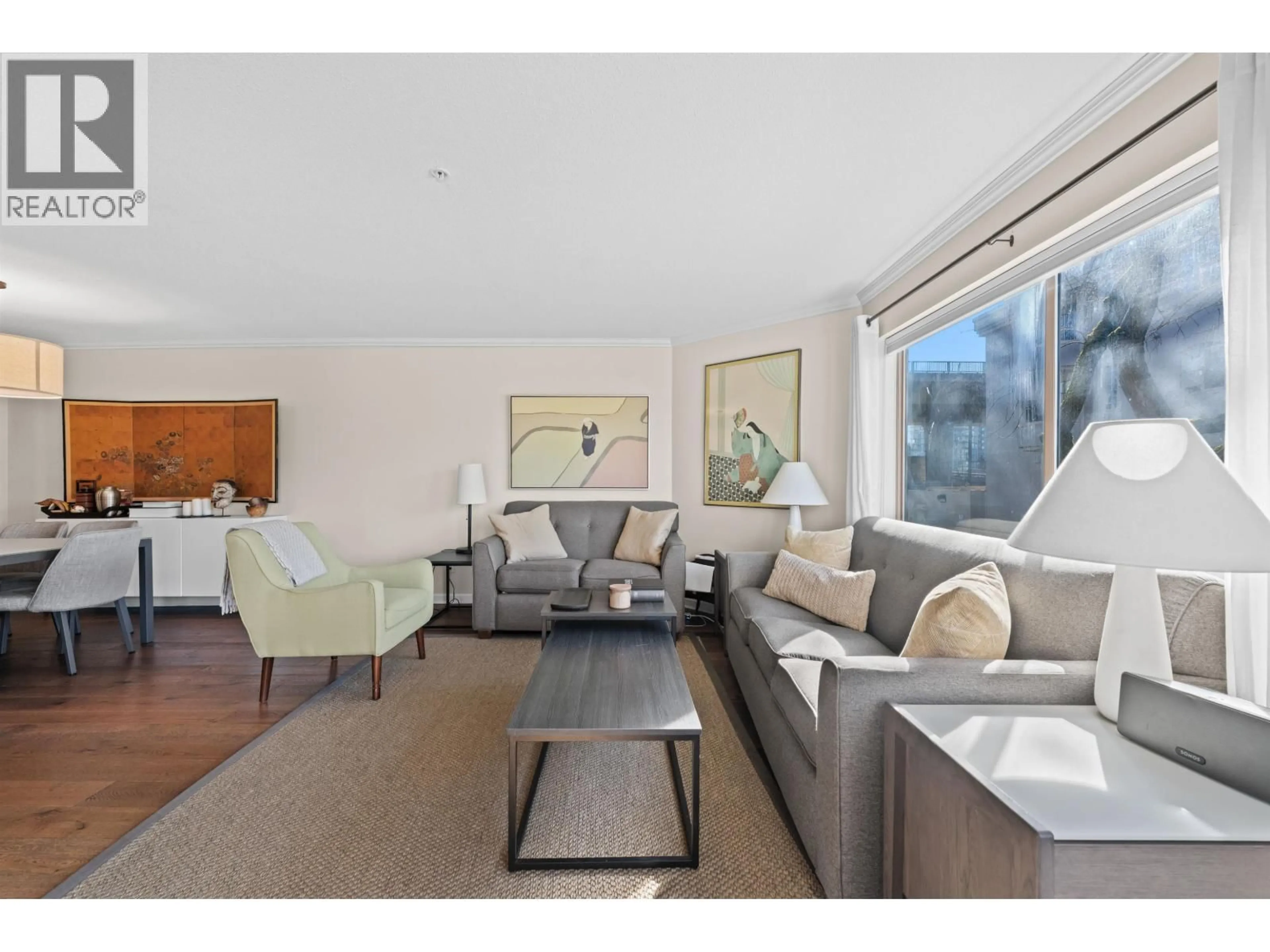 Living room with furniture, wood/laminate floor for 210 - 1859 SPYGLASS PLACE, Vancouver British Columbia V5Z4K6