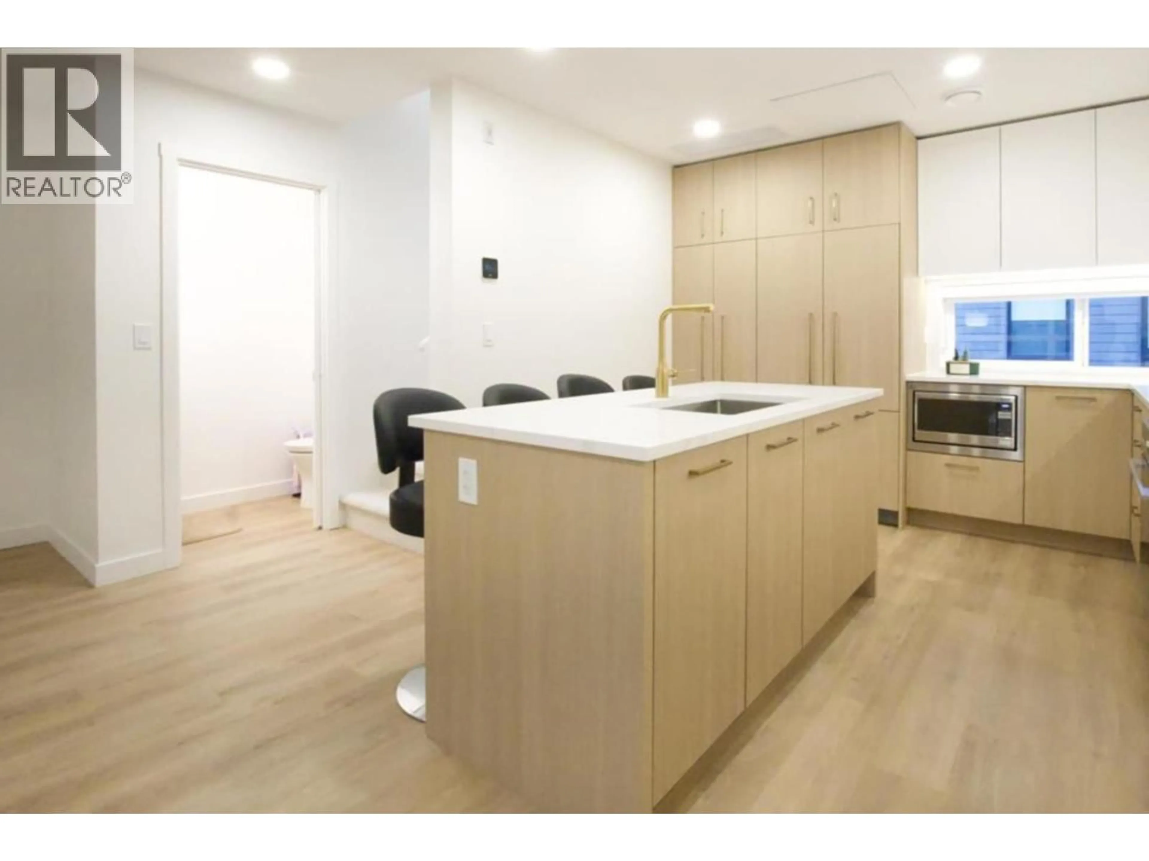 Open concept kitchen, wood/laminate floor for 202 - 381 CLAYTON STREET, Coquitlam British Columbia V3K0J8