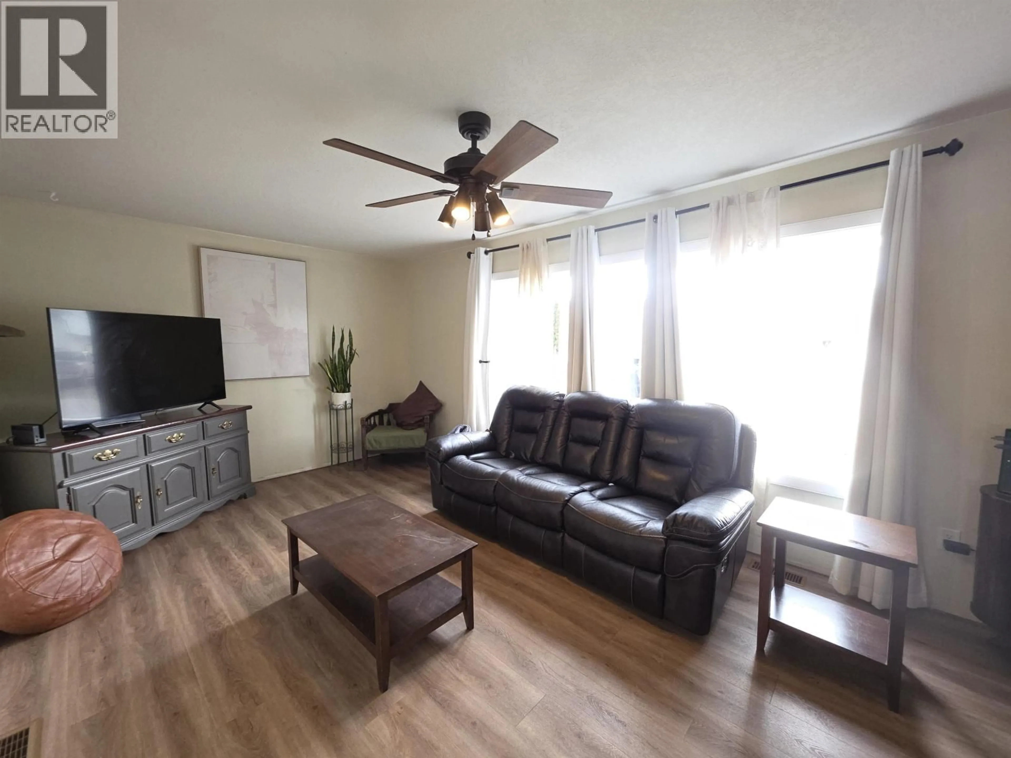 Living room with furniture, wood/laminate floor for 341 2ND STREET, Vanderhoof British Columbia V0J3A0