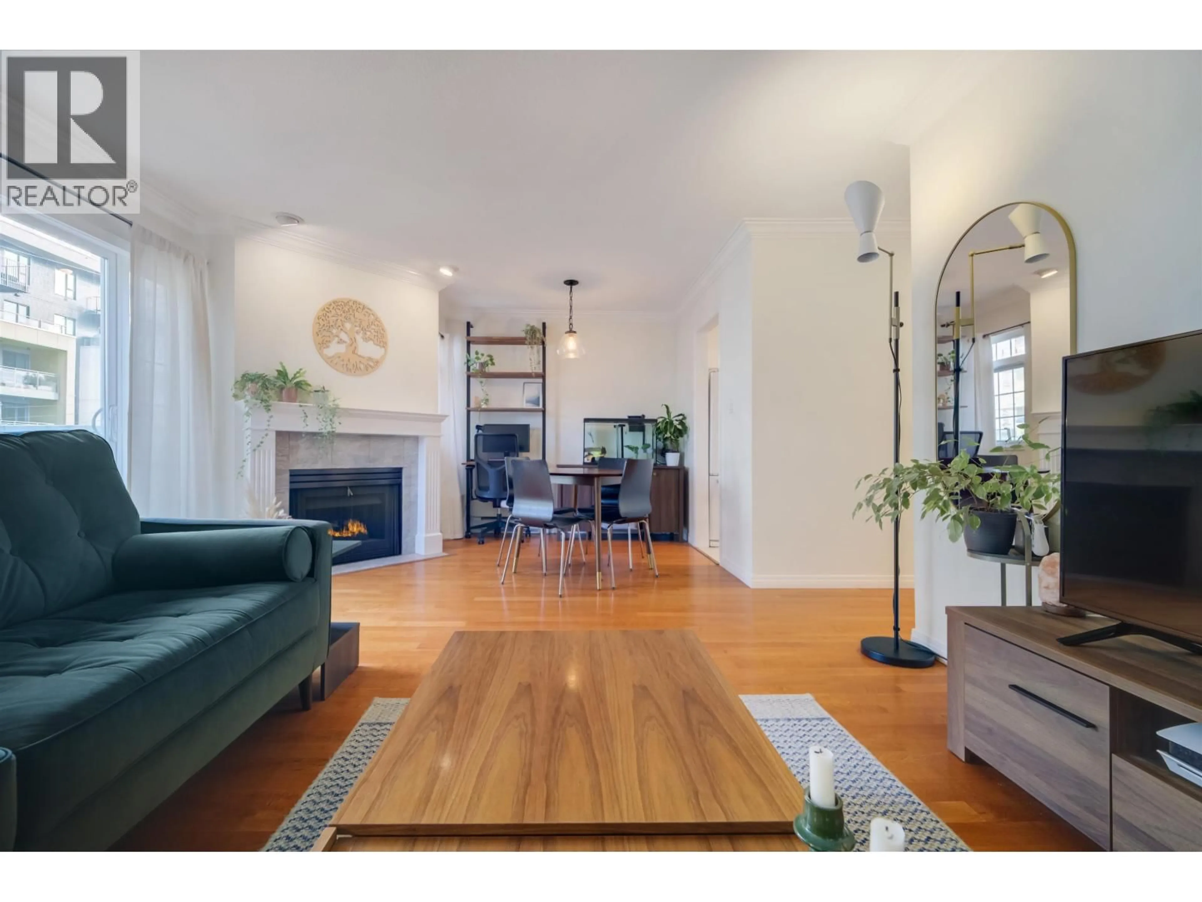 Living room with furniture, wood/laminate floor for 301 - 1868 11TH AVENUE, Vancouver British Columbia V5N1Z1