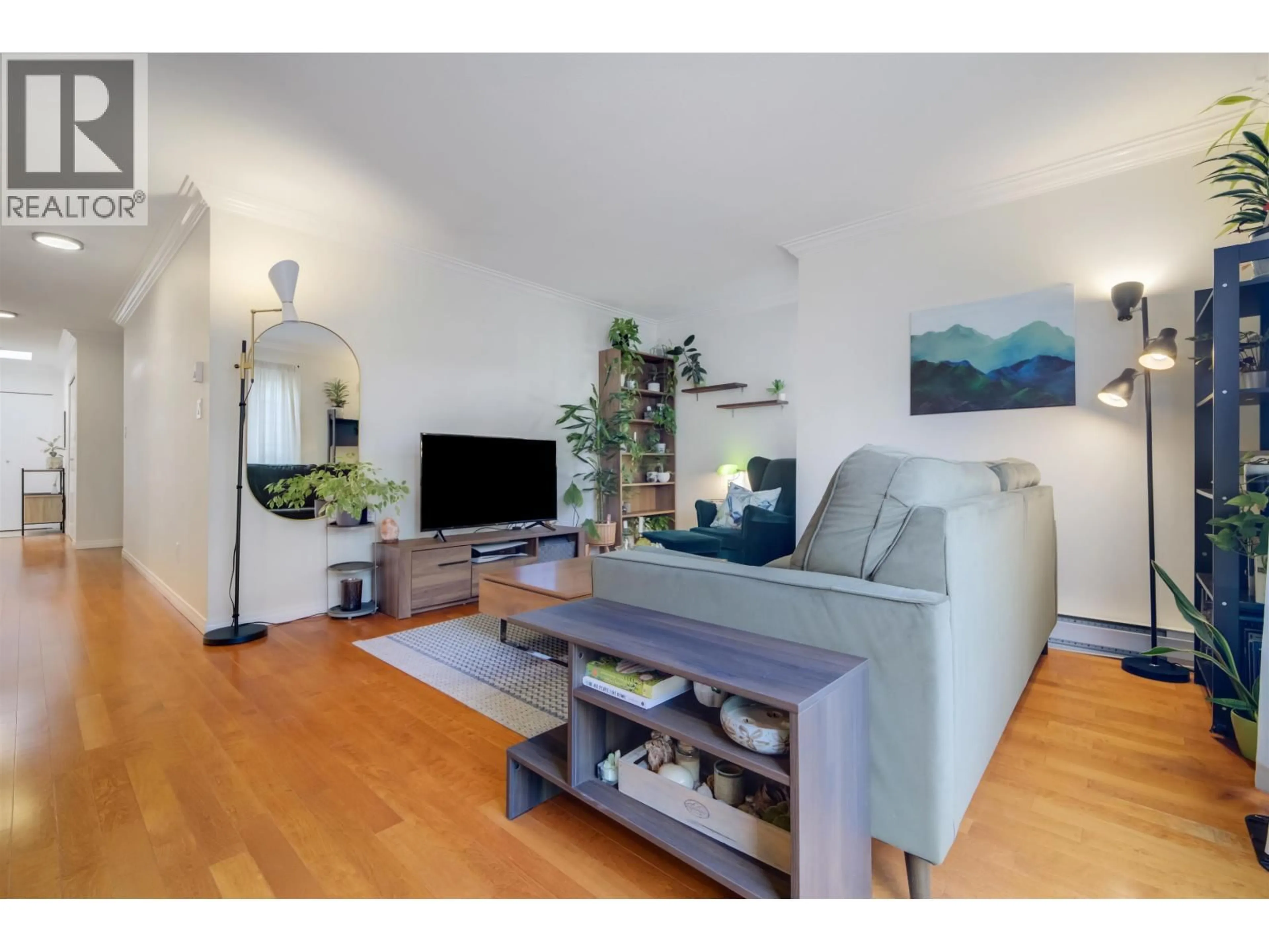 Living room with furniture, wood/laminate floor for 301 - 1868 11TH AVENUE, Vancouver British Columbia V5N1Z1