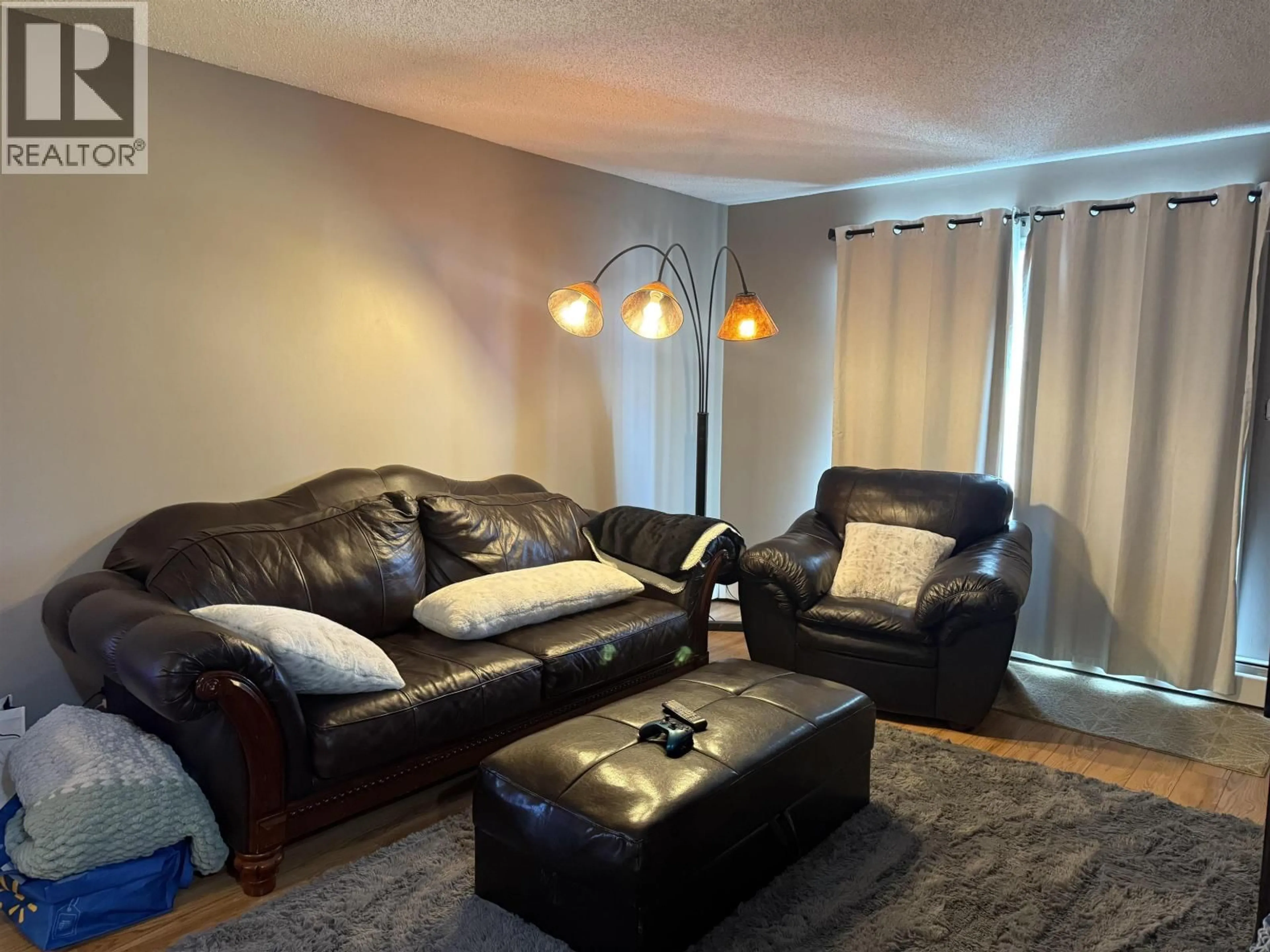 Living room with furniture, unknown for 101 - 10216 102 AVENUE, Fort St. John British Columbia V1J2E5
