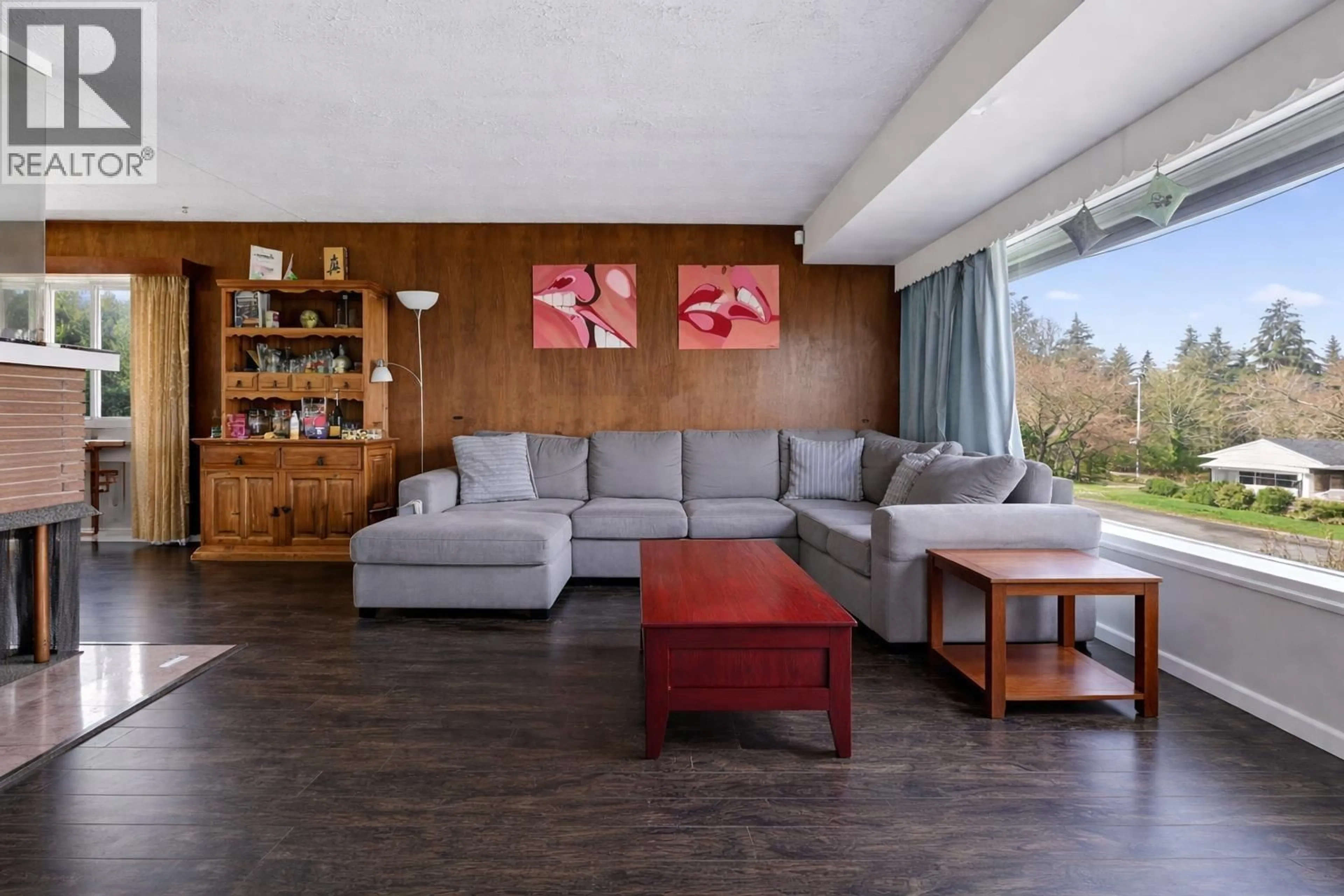 Living room with furniture, wood/laminate floor for 7016 SIERRA DRIVE, Burnaby British Columbia V5A1A5