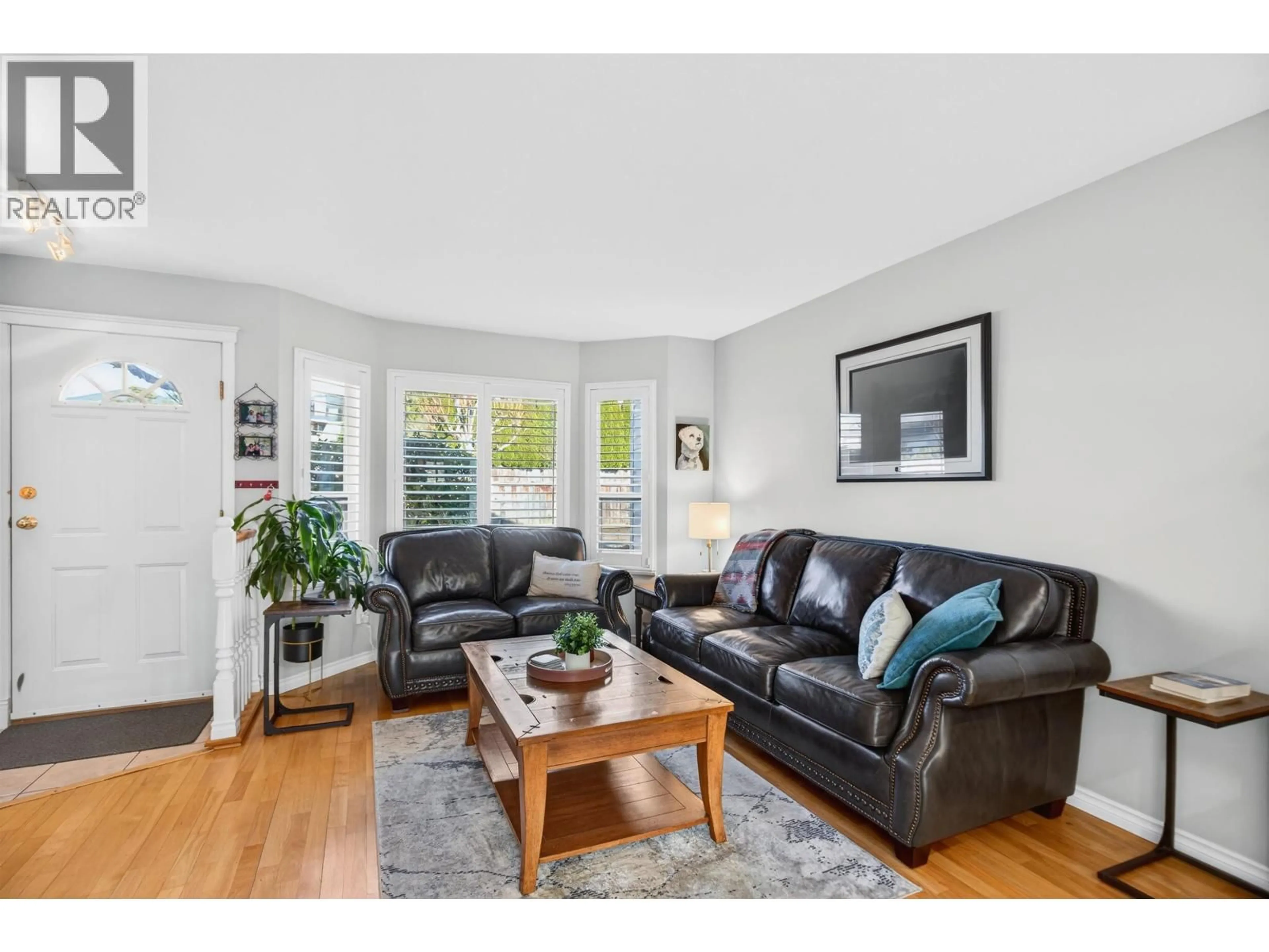 Living room with furniture, wood/laminate floor for 67 - 11588 232 STREET, Maple Ridge British Columbia V2X0J6