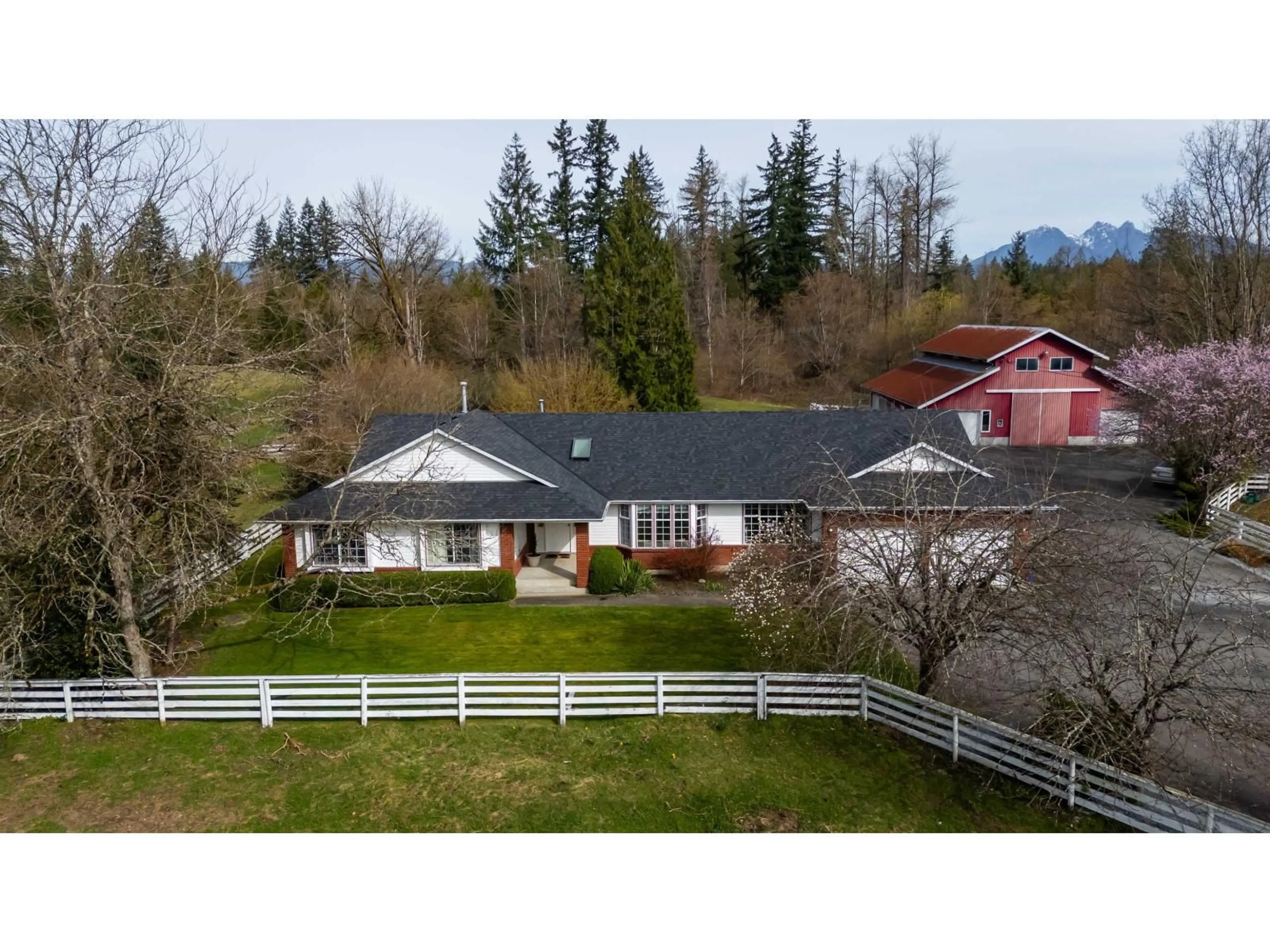 A pic from outside/outdoor area/front of a property/back of a property/a pic from drone, mountain view for 21747 100 AVENUE, Langley British Columbia V1M3V1