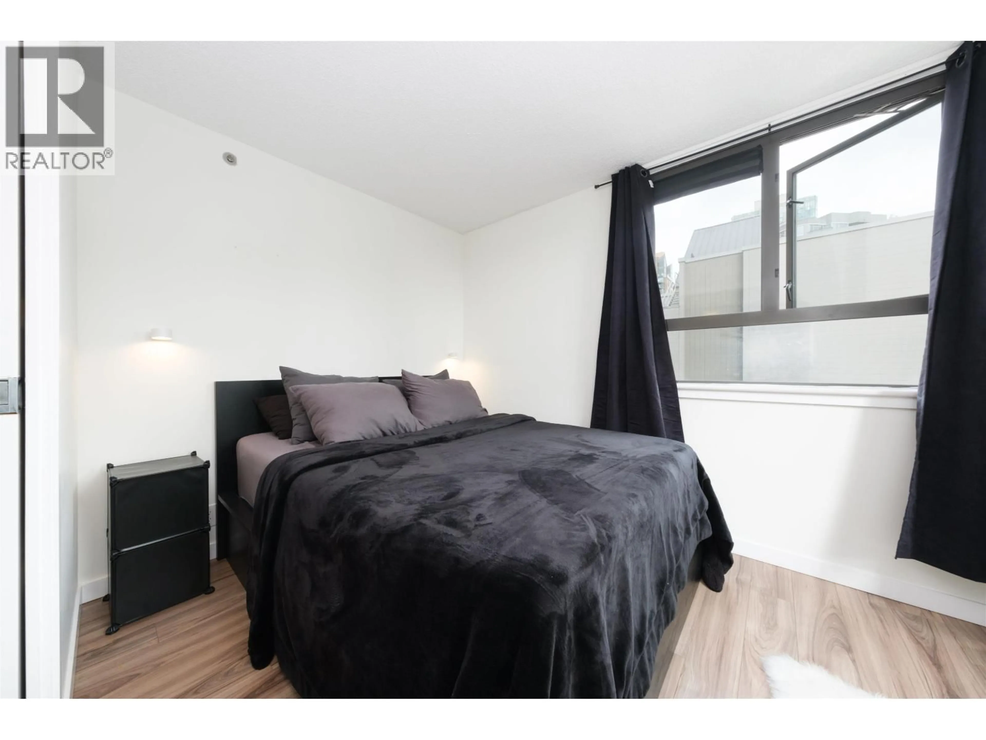Bedroom with bed, wood/laminate floor for 801 - 789 DRAKE STREET, Vancouver British Columbia V6Z2N7