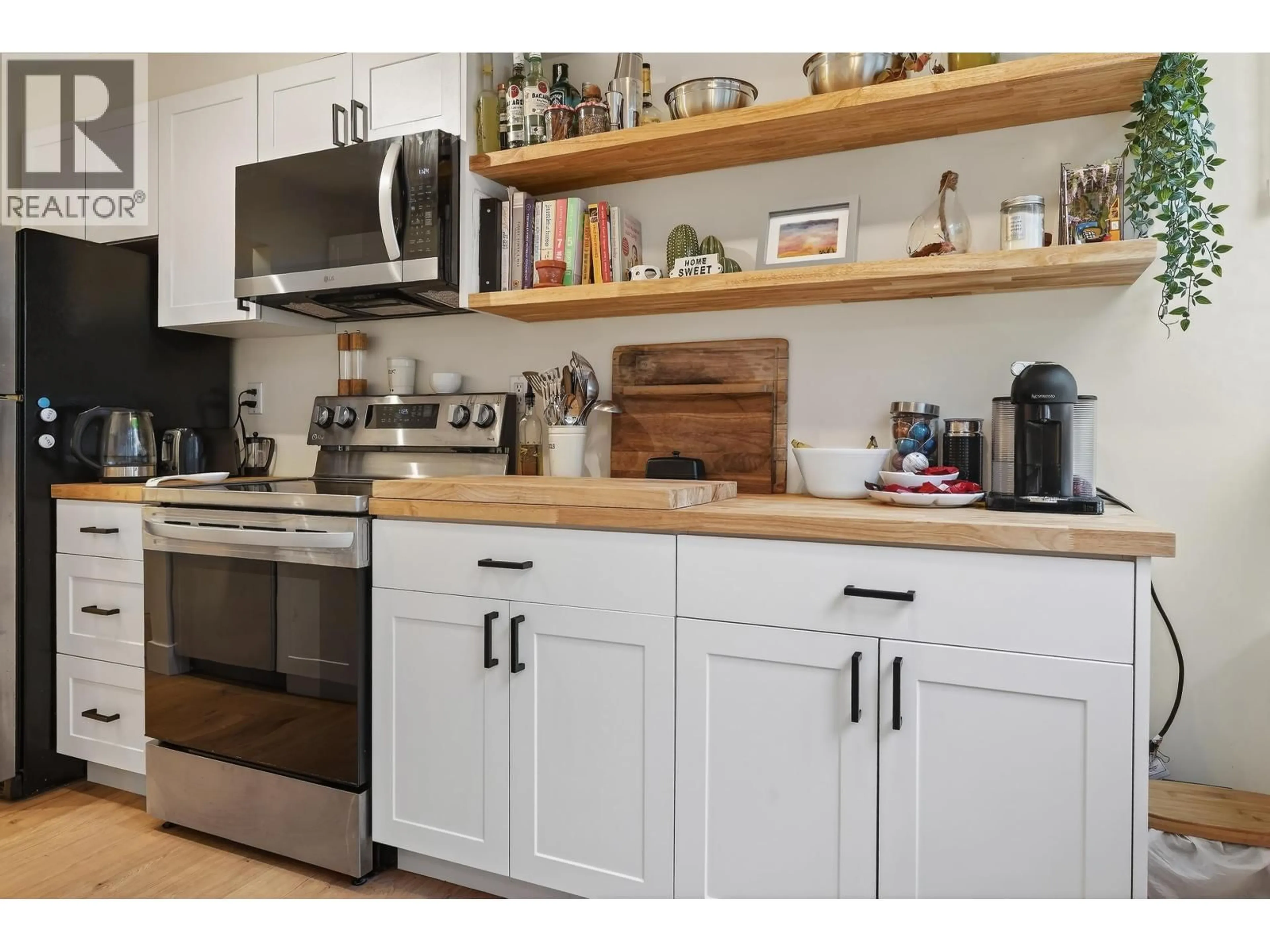 Open concept kitchen, wood/laminate floor for 202 - 1280 NICOLA STREET, Vancouver British Columbia V6G2E9