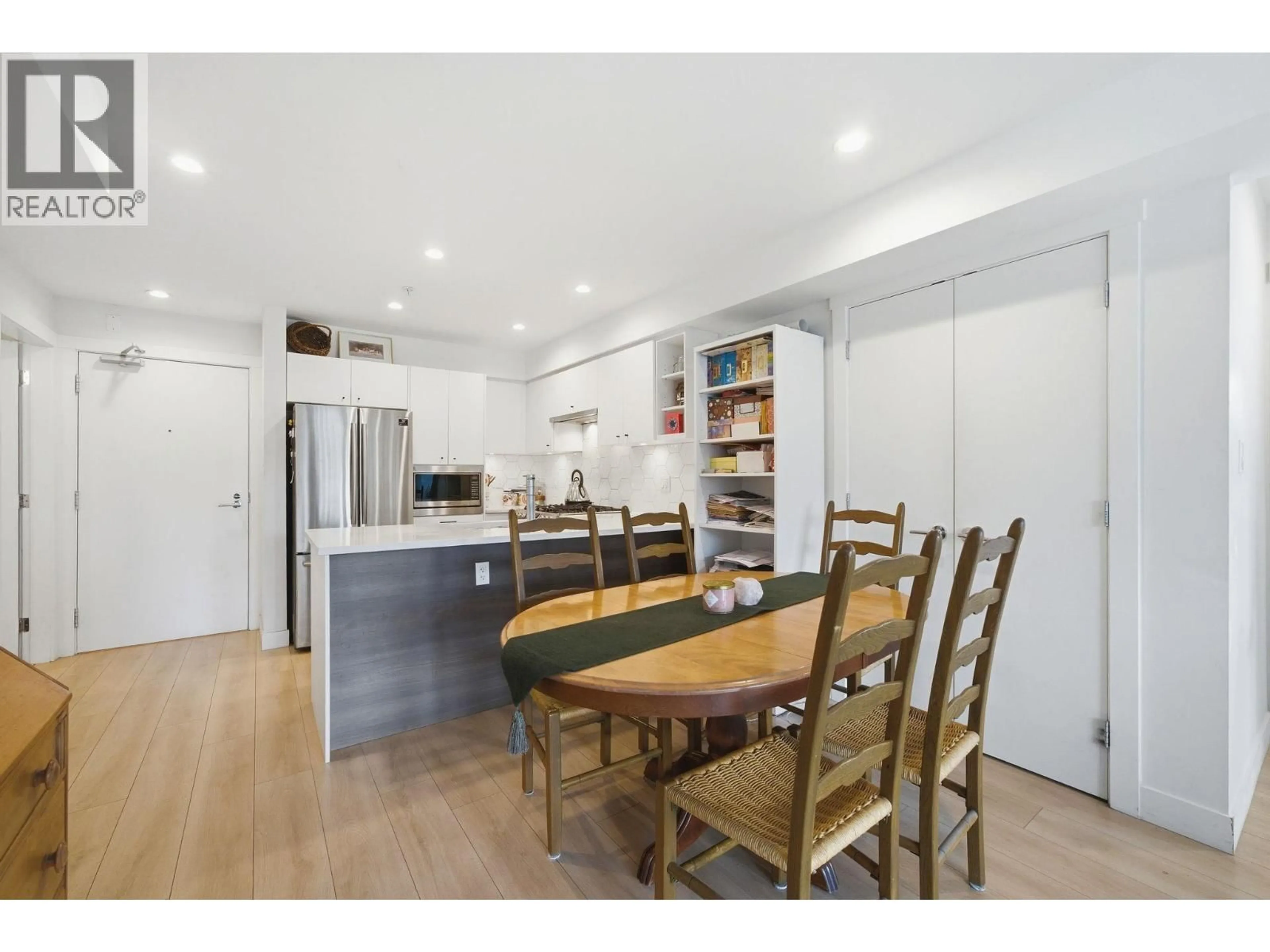 Open concept kitchen, wood/laminate floor for 204 - 1519 CROWN STREET, North Vancouver British Columbia V7J1G6