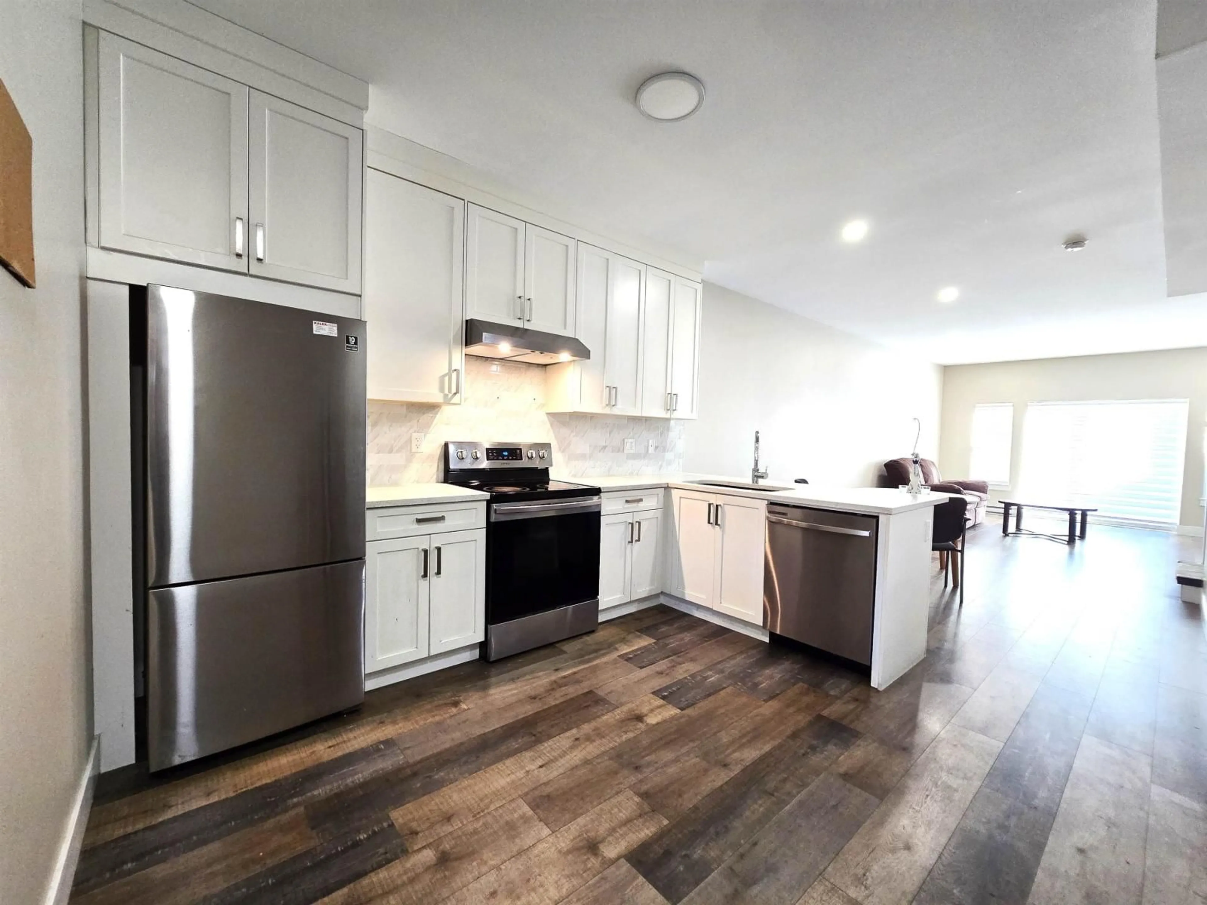 Open concept kitchen, wood/laminate floor for 4 - 1950 SALTON ROAD, Abbotsford British Columbia V2S0L1