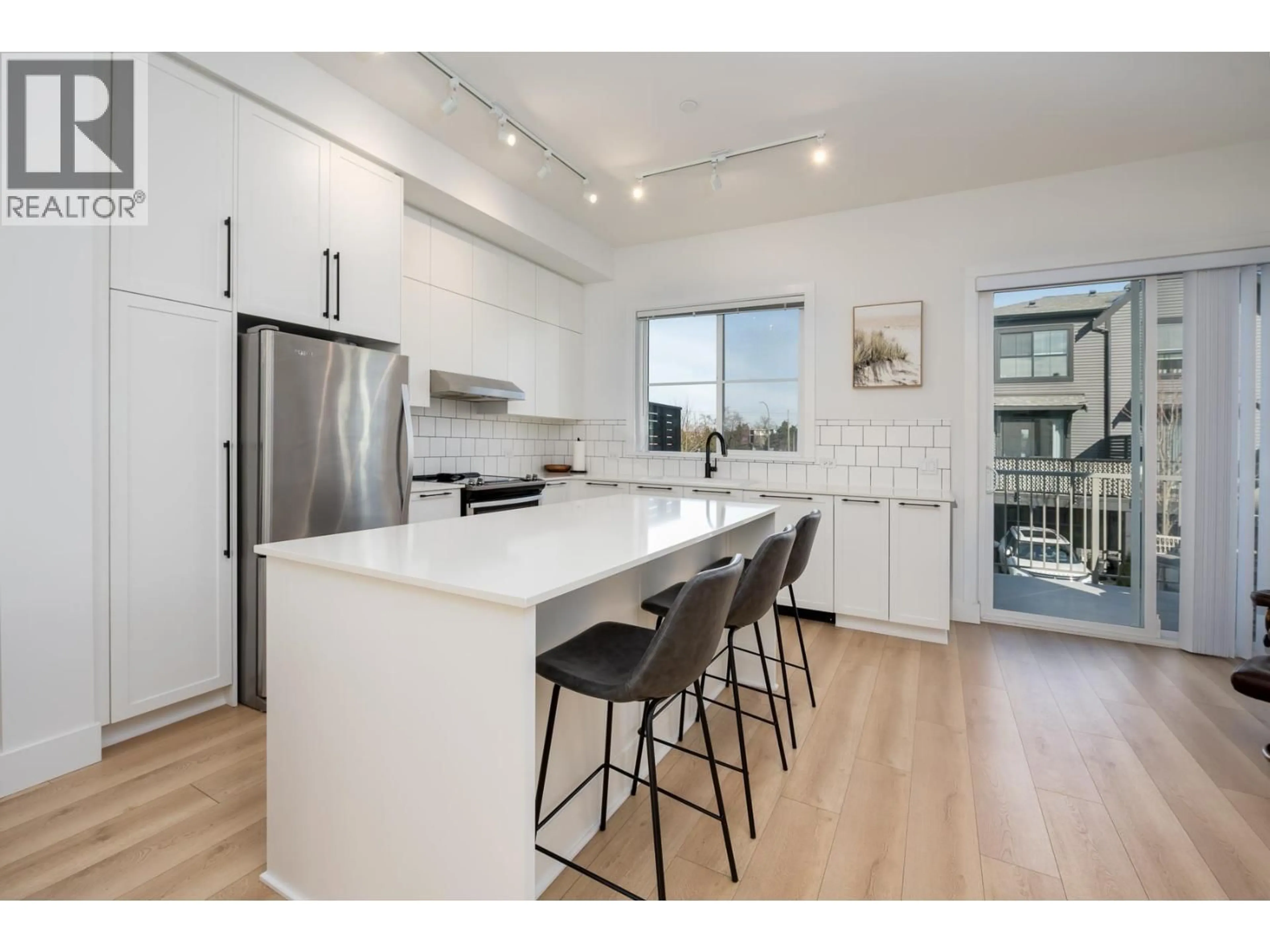 Open concept kitchen, wood/laminate floor for 6 - 4726 ORCA WAY, Tsawwassen British Columbia V4M0E7