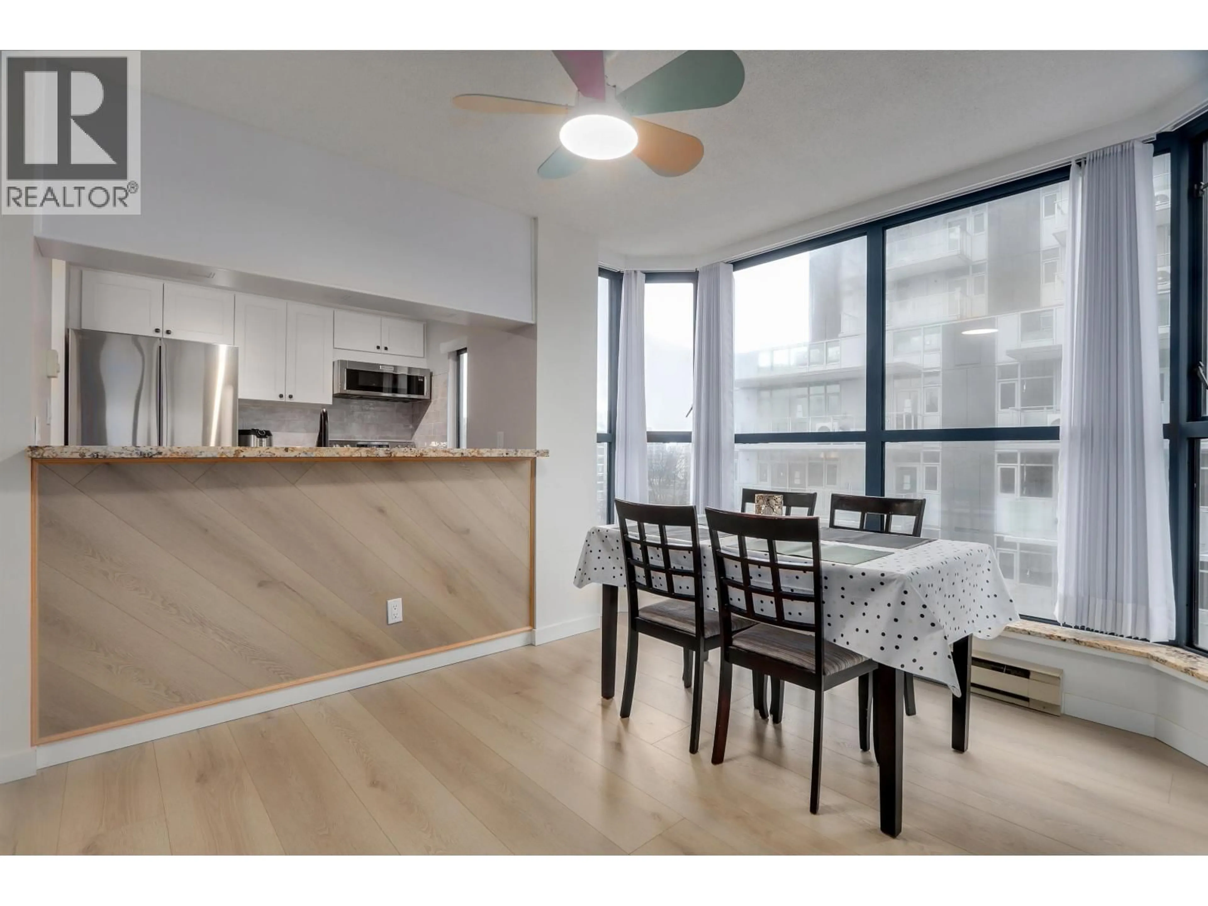 Open concept kitchen, wood/laminate floor for 810 - 1268 BROADWAY, Vancouver British Columbia V6H1G6