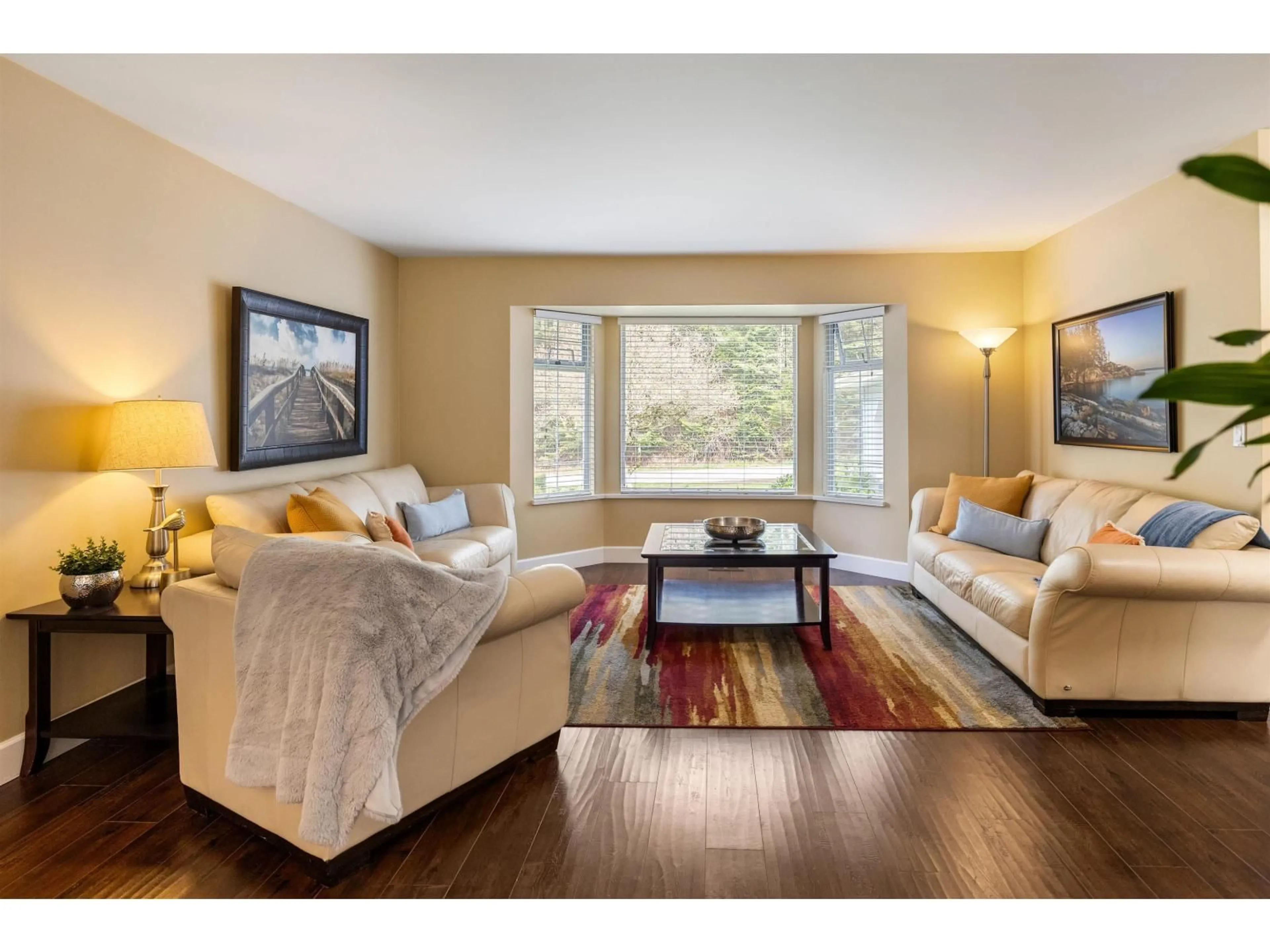 Living room with furniture, wood/laminate floor for 14316 92 AVENUE, Surrey British Columbia V3V1J6