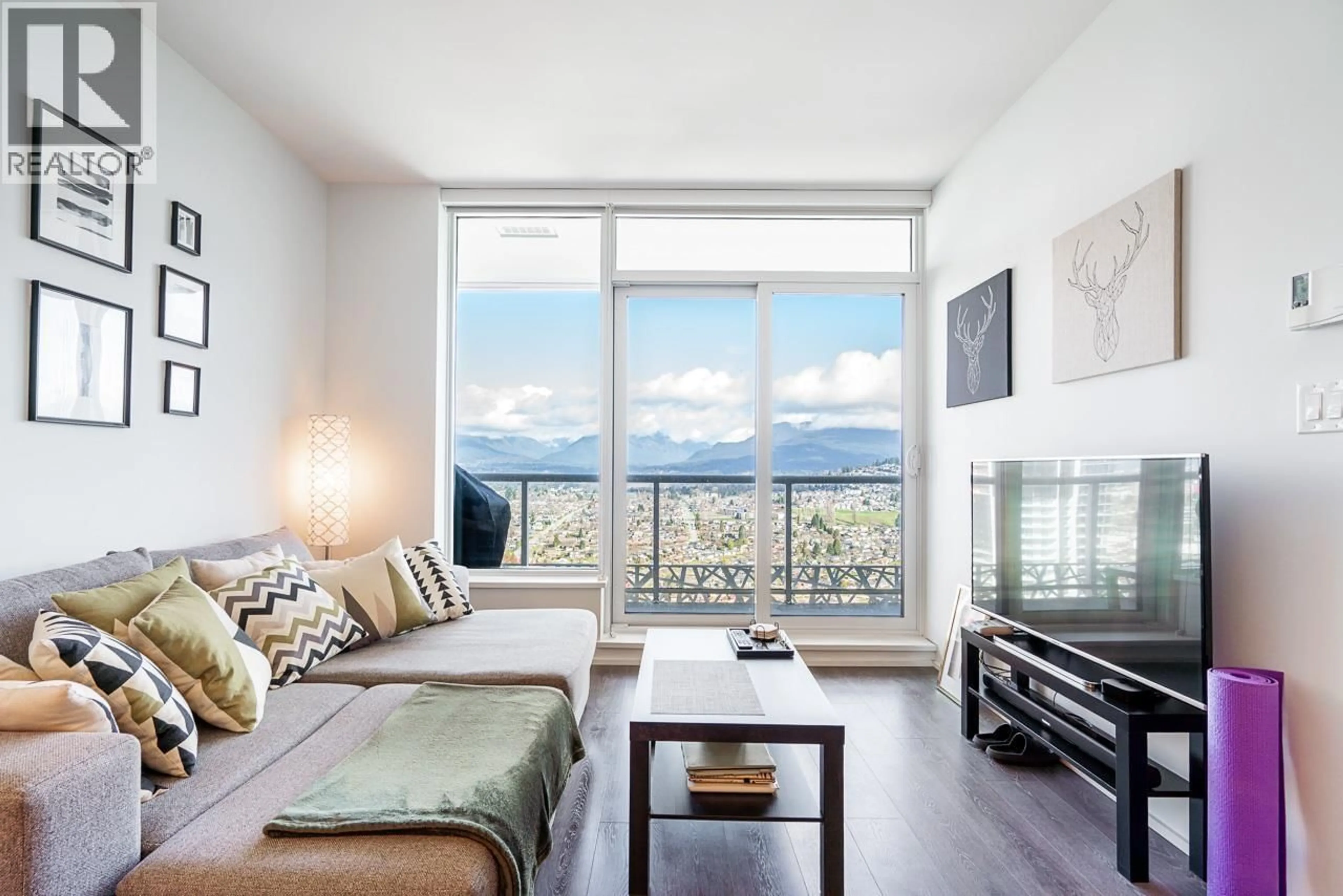 Living room with furniture, wood/laminate floor for 4210 - 1955 ALPHA WAY, Burnaby British Columbia V5C0K6