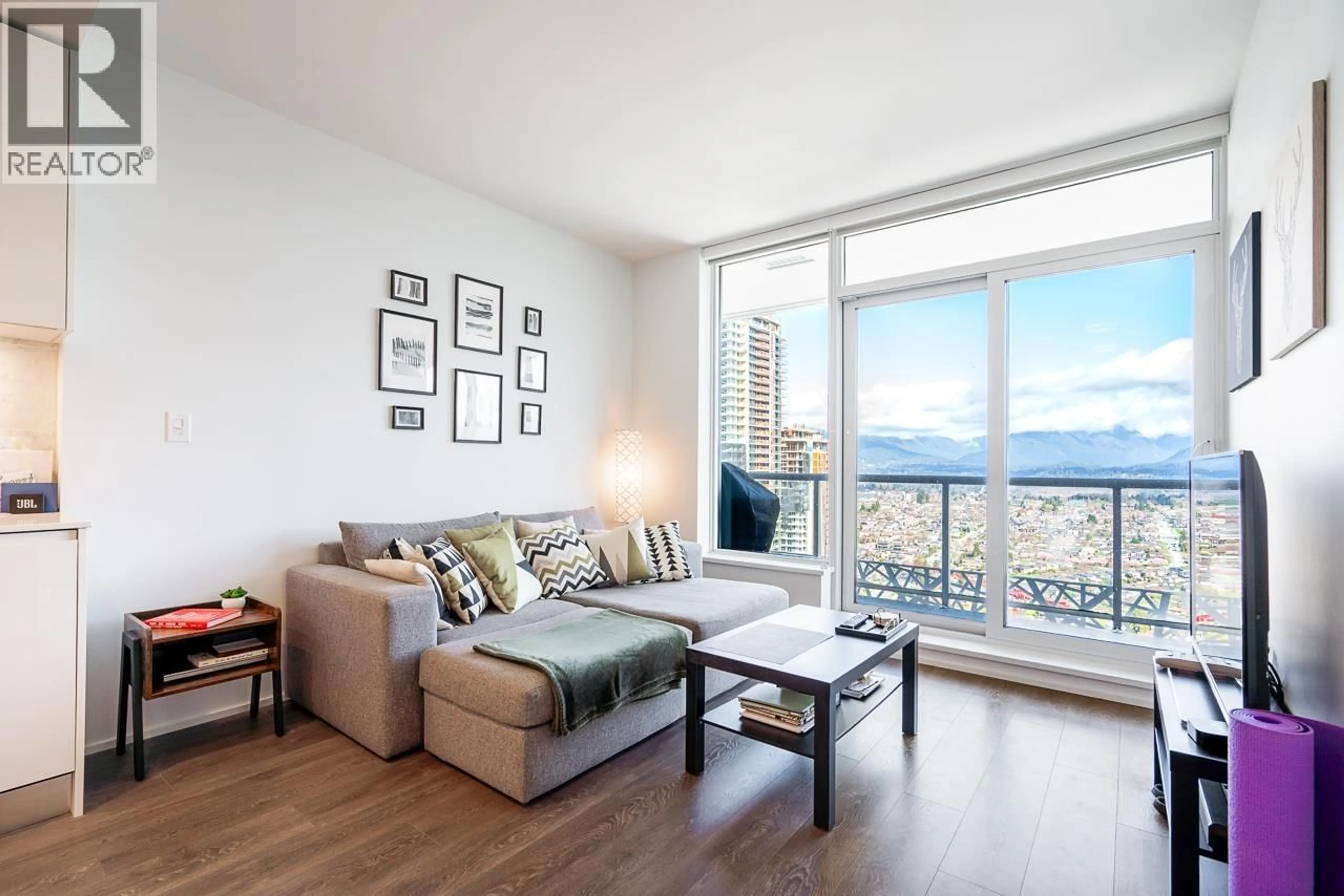 Living room with furniture, wood/laminate floor for 4210 - 1955 ALPHA WAY, Burnaby British Columbia V5C0K6