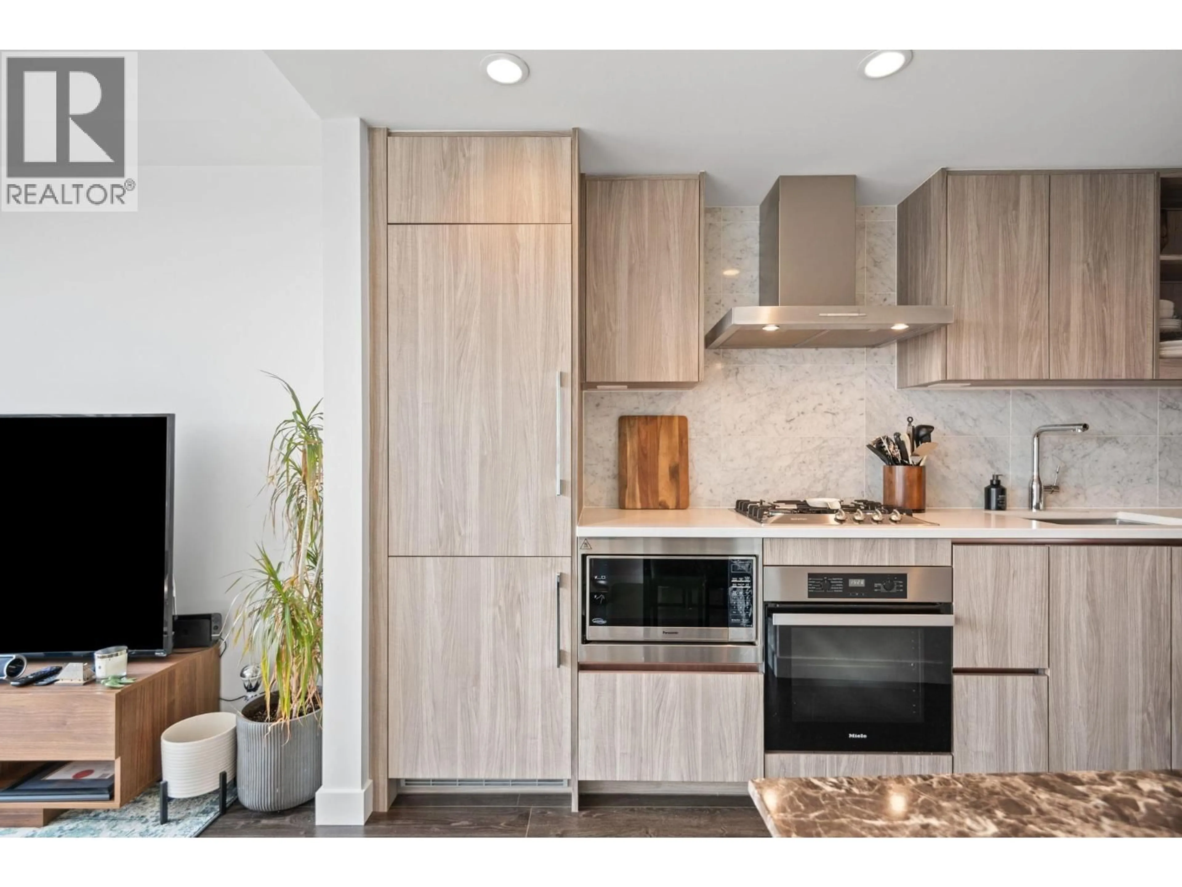Open concept kitchen, wood/laminate floor for 1501 - 1768 COOK STREET, Vancouver British Columbia V5Y0N3