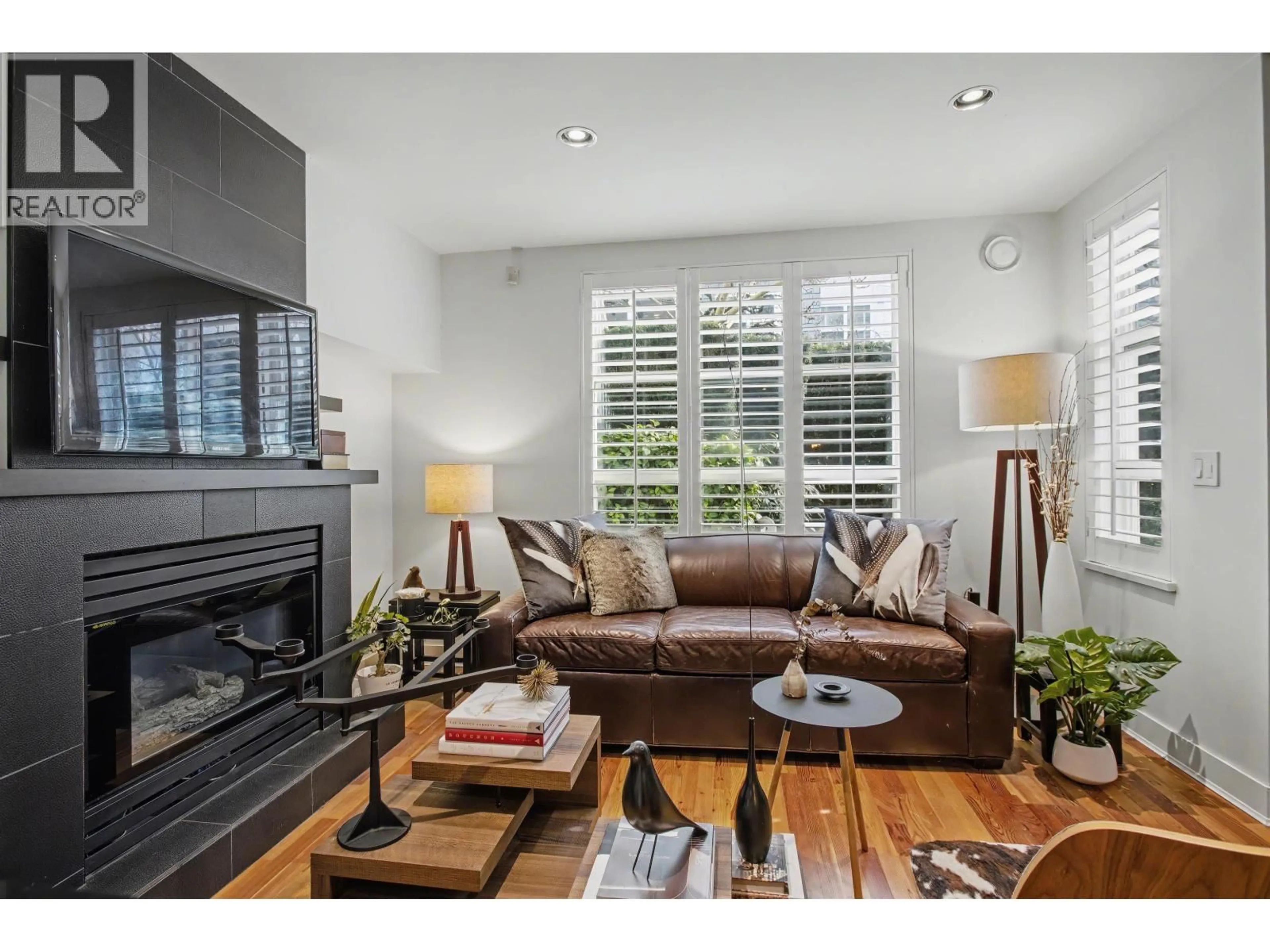 Living room with furniture, wood/laminate floor for 103 - 669 7TH AVENUE, Vancouver British Columbia V5Z1B6