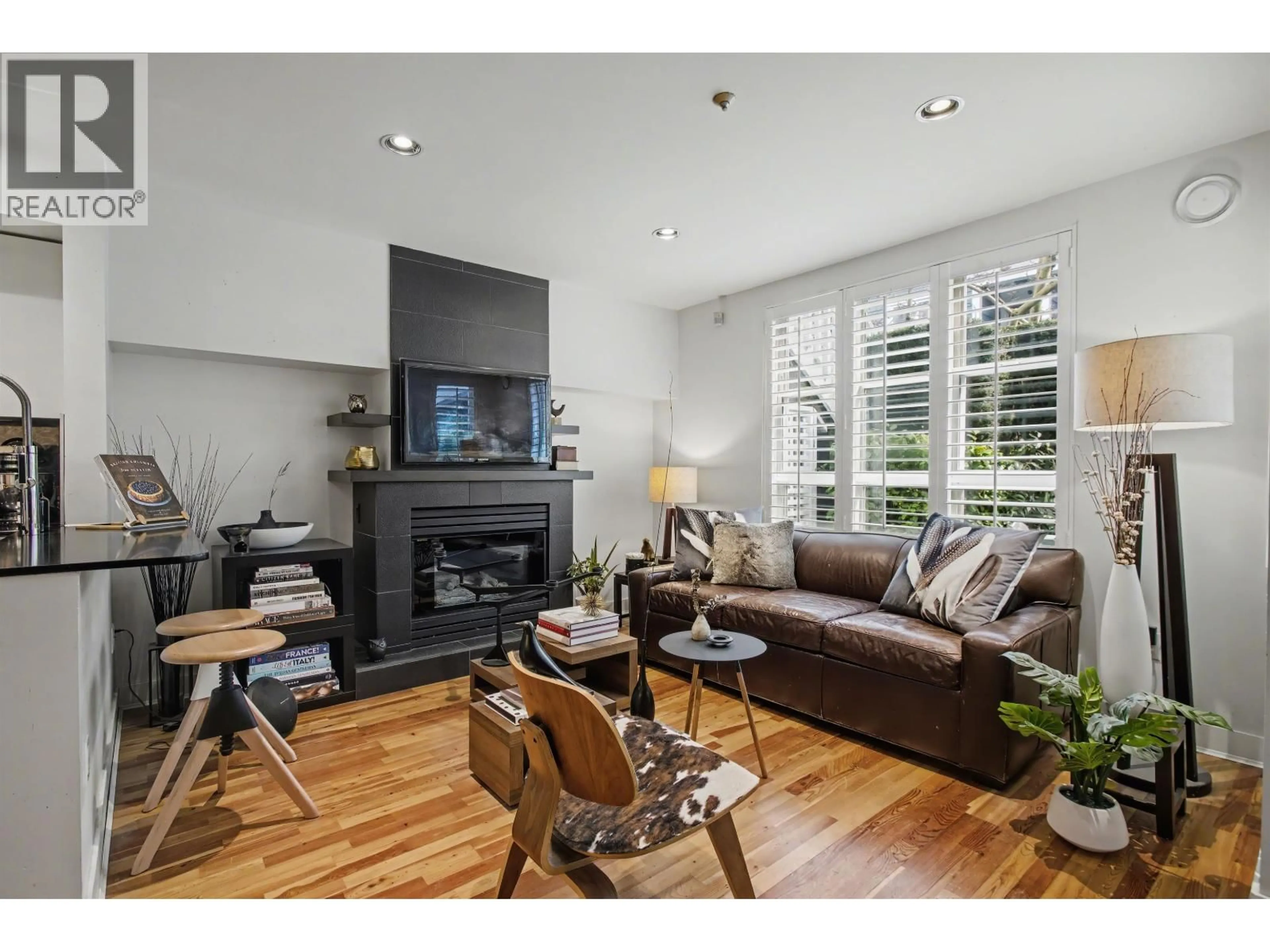 Living room with furniture, wood/laminate floor for 103 - 669 7TH AVENUE, Vancouver British Columbia V5Z1B6