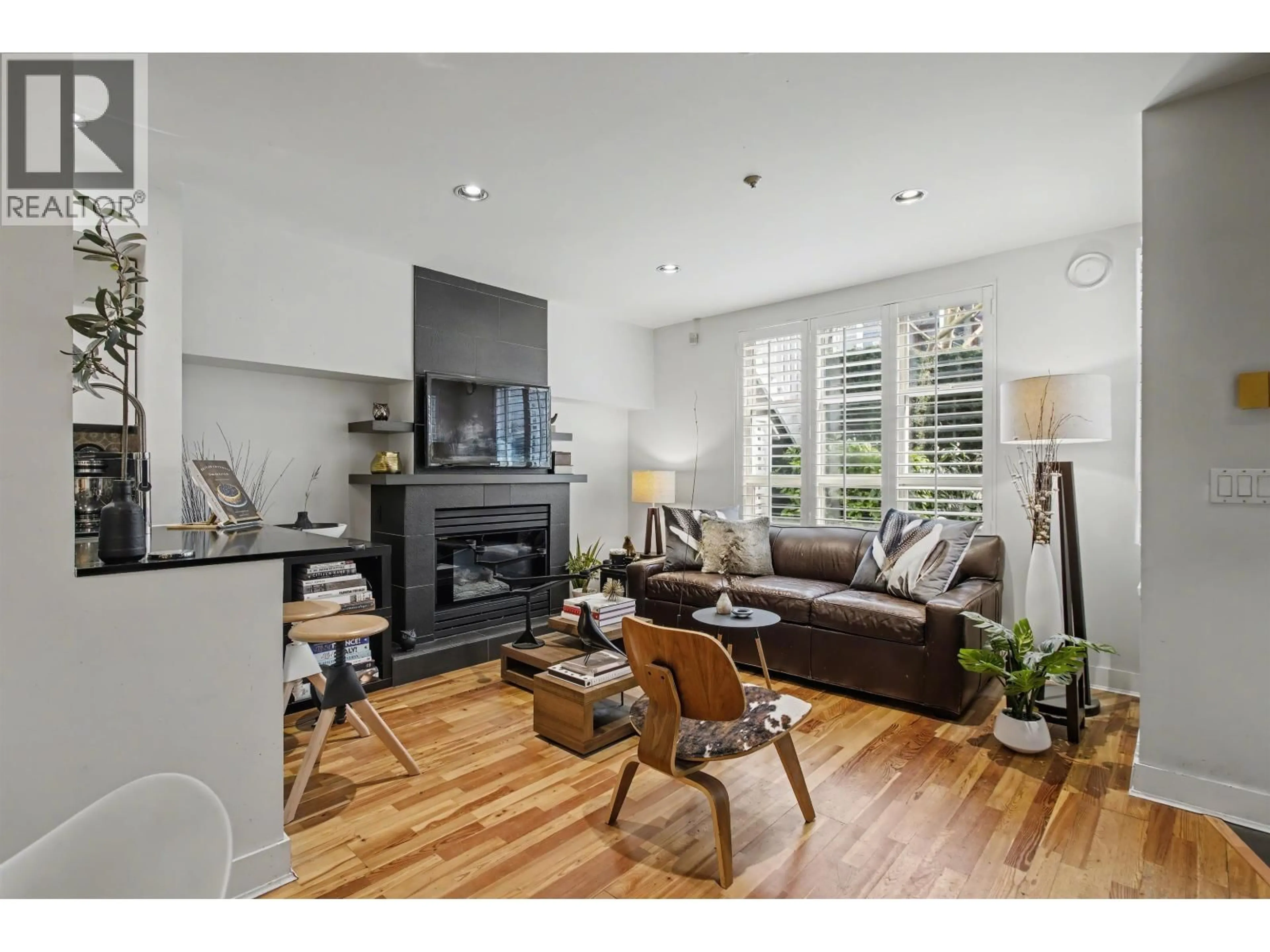 Living room with furniture, wood/laminate floor for 103 - 669 7TH AVENUE, Vancouver British Columbia V5Z1B6