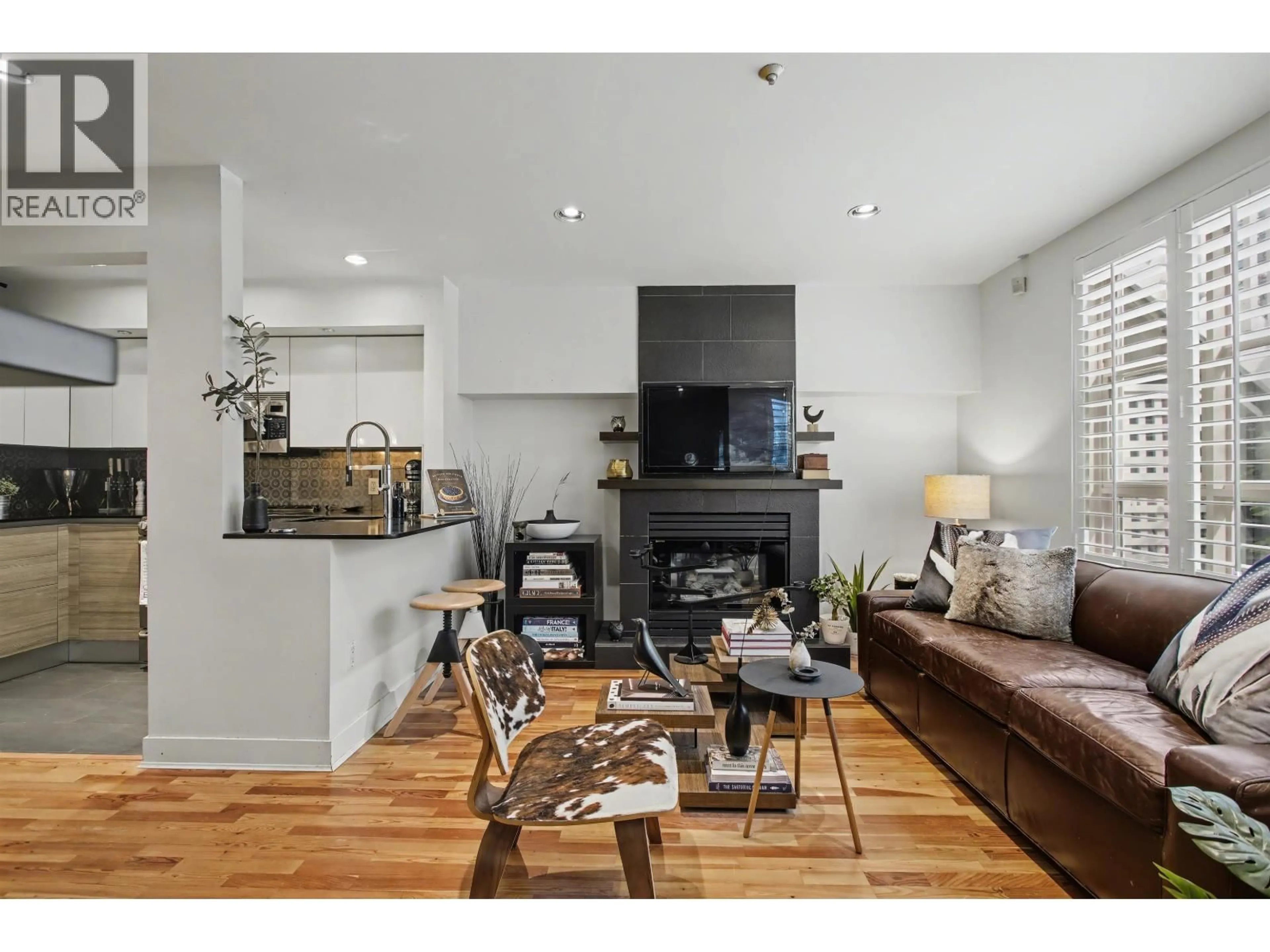 Living room with furniture, wood/laminate floor for 103 - 669 7TH AVENUE, Vancouver British Columbia V5Z1B6