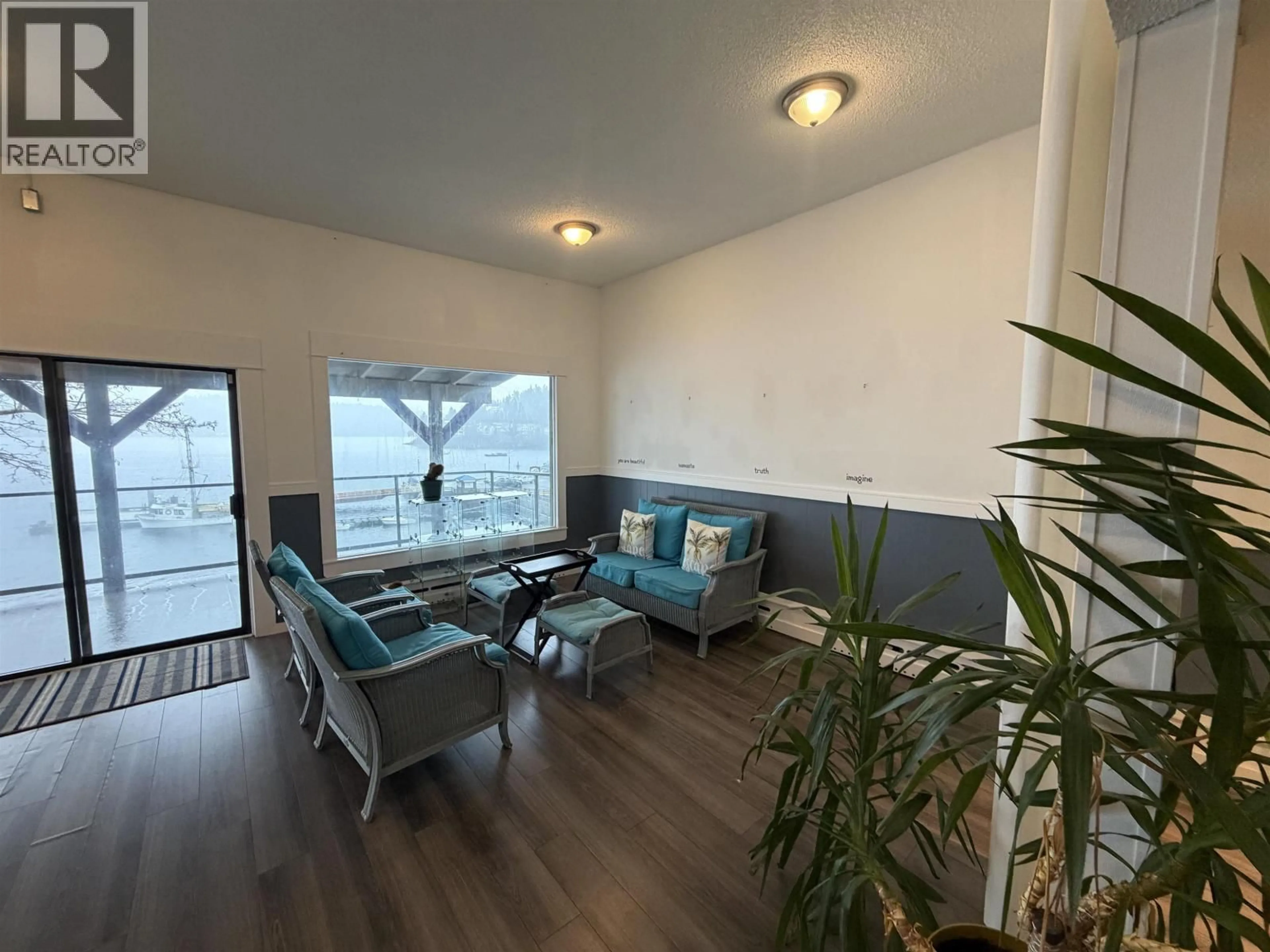 Living room with furniture, wood/laminate floor for 418 MARINE DRIVE, Gibsons British Columbia V0N1V9