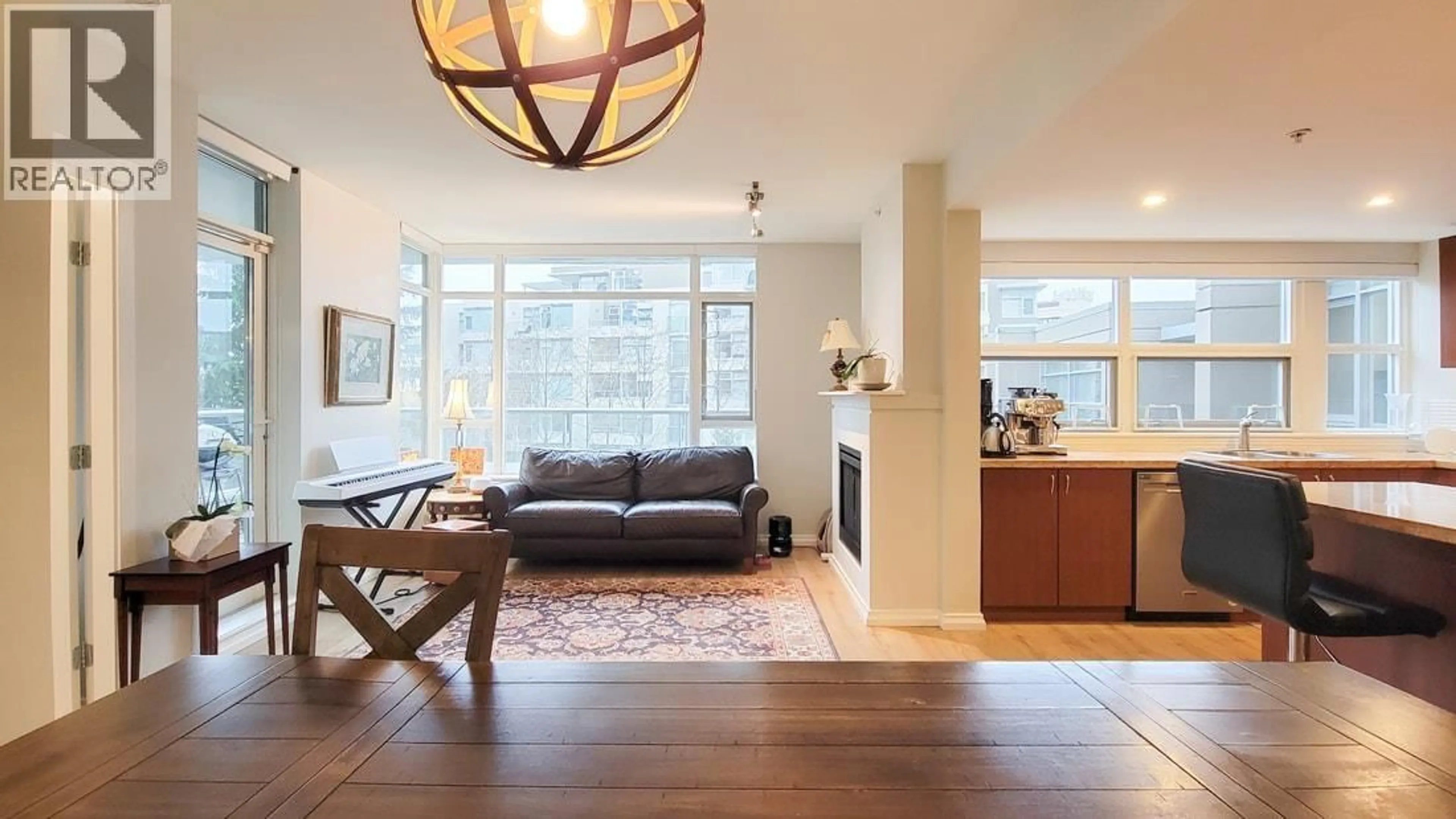 Living room with furniture, unknown for 301 - 9266 UNIVERSITY CRESCENT, Burnaby British Columbia V5A4Z1