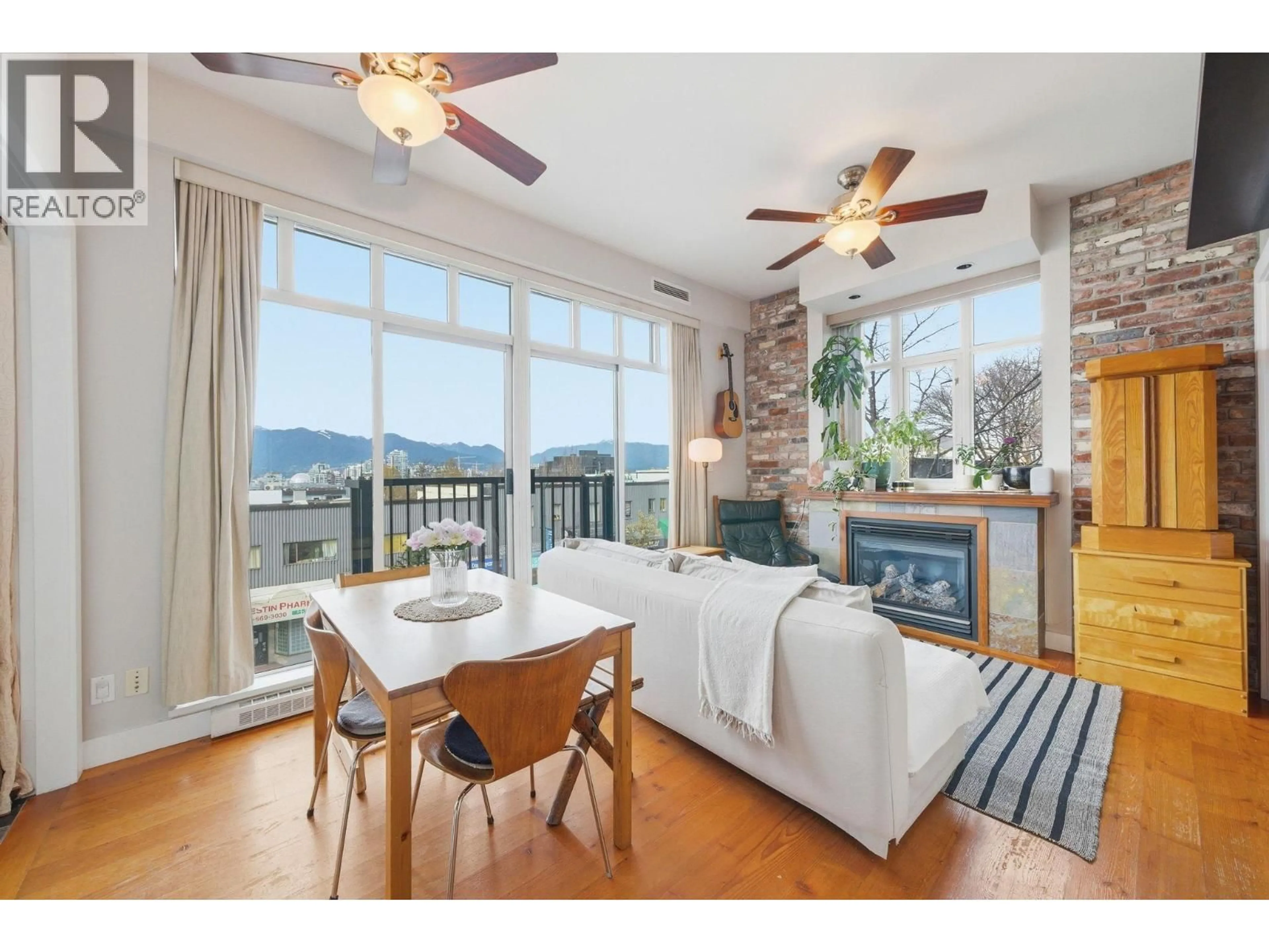 Living room with furniture, wood/laminate floor for 210 - 2515 ONTARIO STREET, Vancouver British Columbia V5T4V4