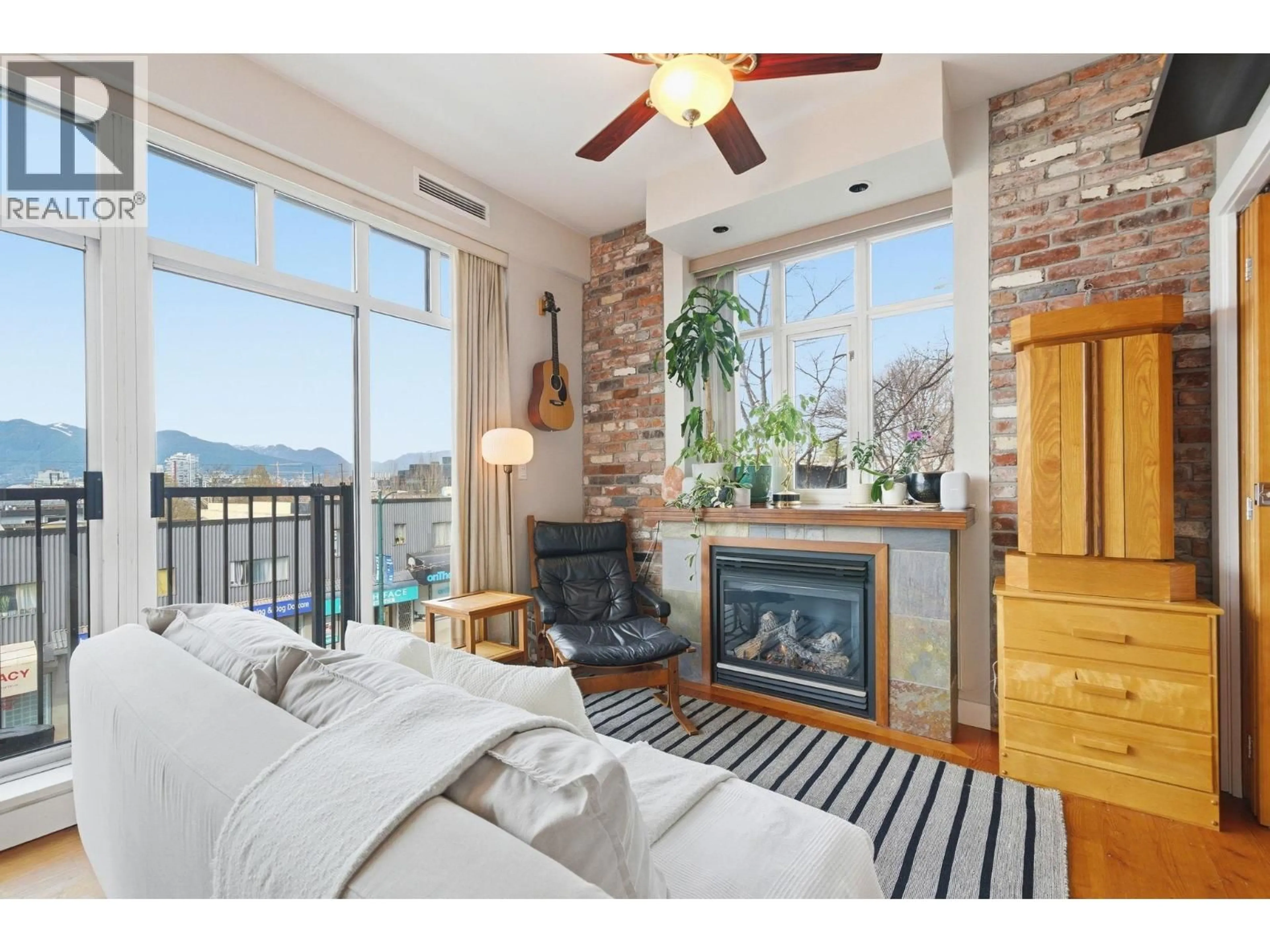 Living room with furniture, wood/laminate floor for 210 - 2515 ONTARIO STREET, Vancouver British Columbia V5T4V4