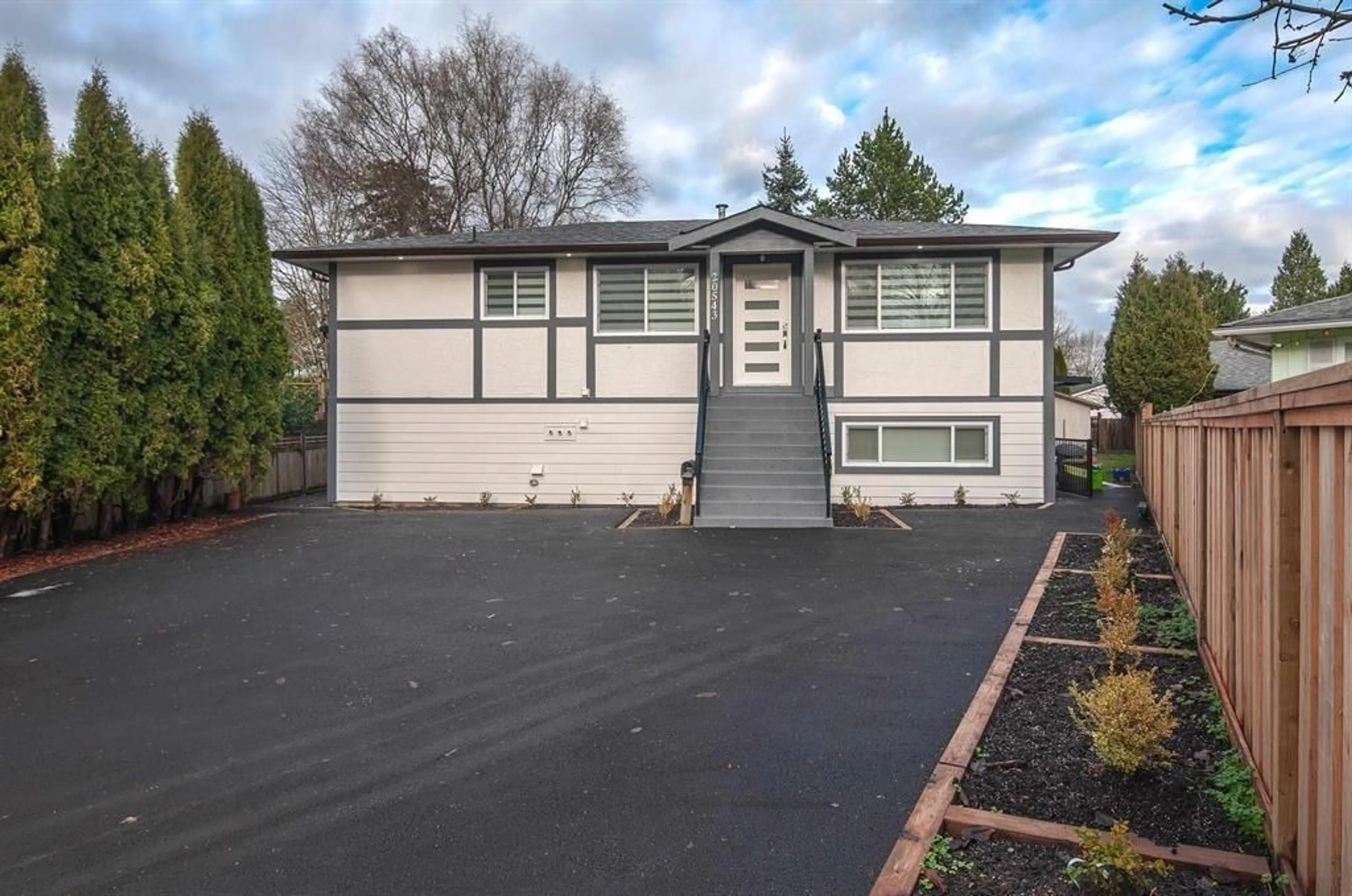Home with vinyl exterior material, street for 20543 50A AVENUE, Langley British Columbia V3A6X3
