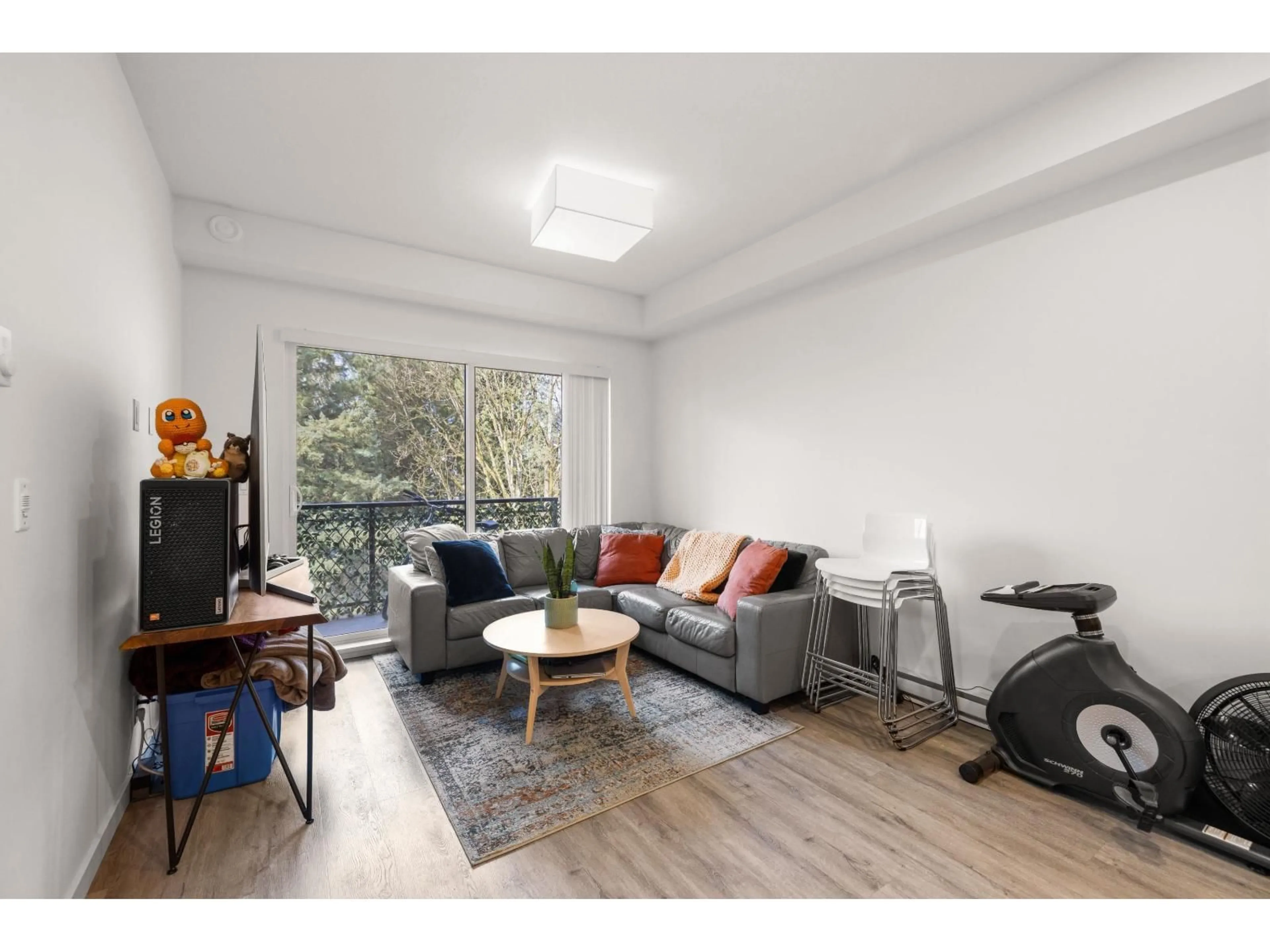 Living room with furniture, wood/laminate floor for B308 - 20087 68 AVENUE, Langley British Columbia V2Y0Y3