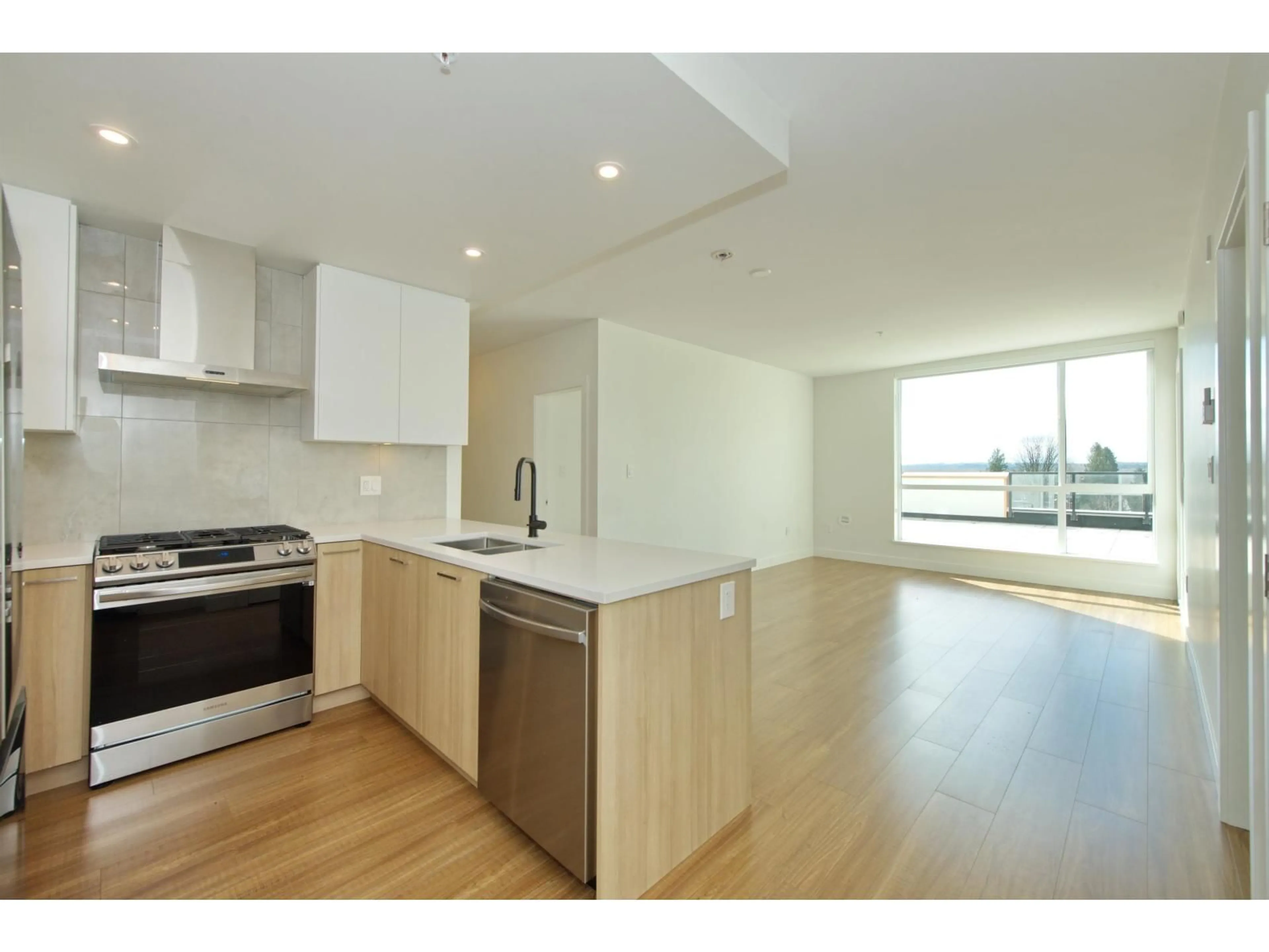 Open concept kitchen, wood/laminate floor for A107 - 31900 RAVEN AVENUE, Mission British Columbia V2V1B8