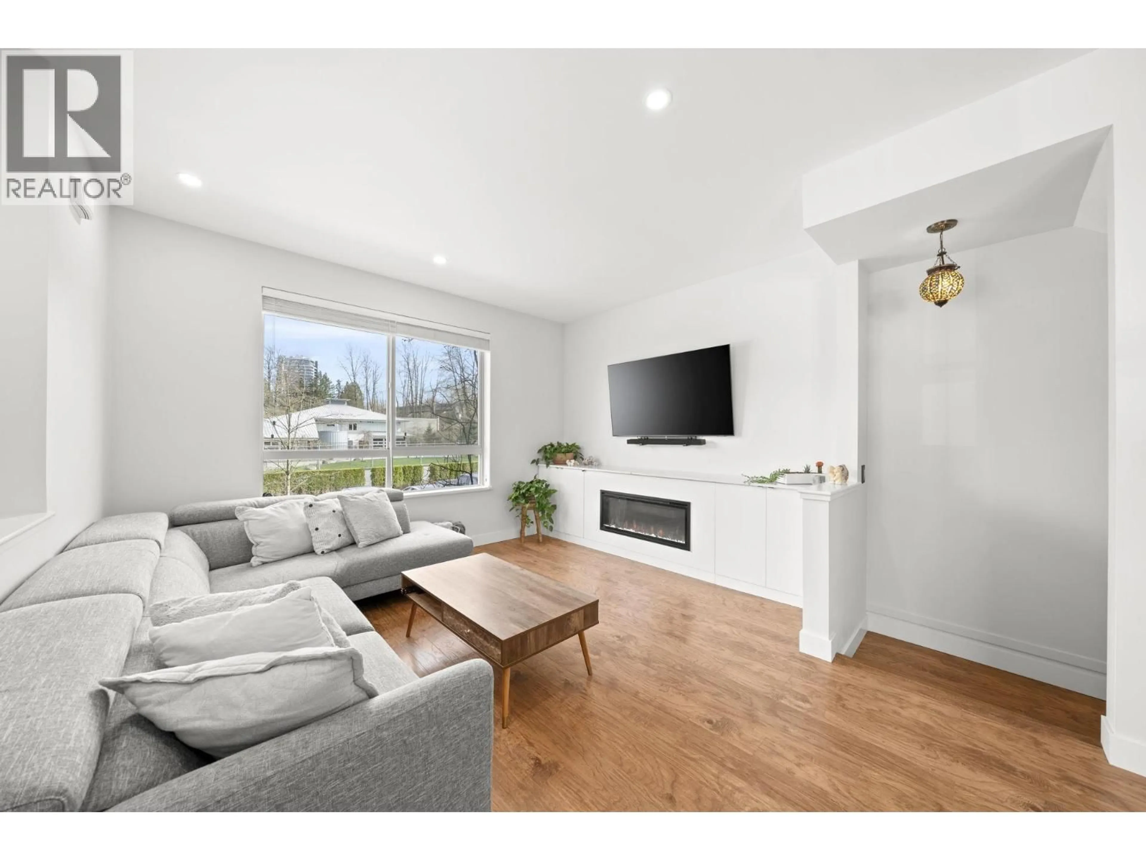 Living room with furniture, wood/laminate floor for 1 - 301 KLAHANIE DRIVE, Port Moody British Columbia V3H0C2