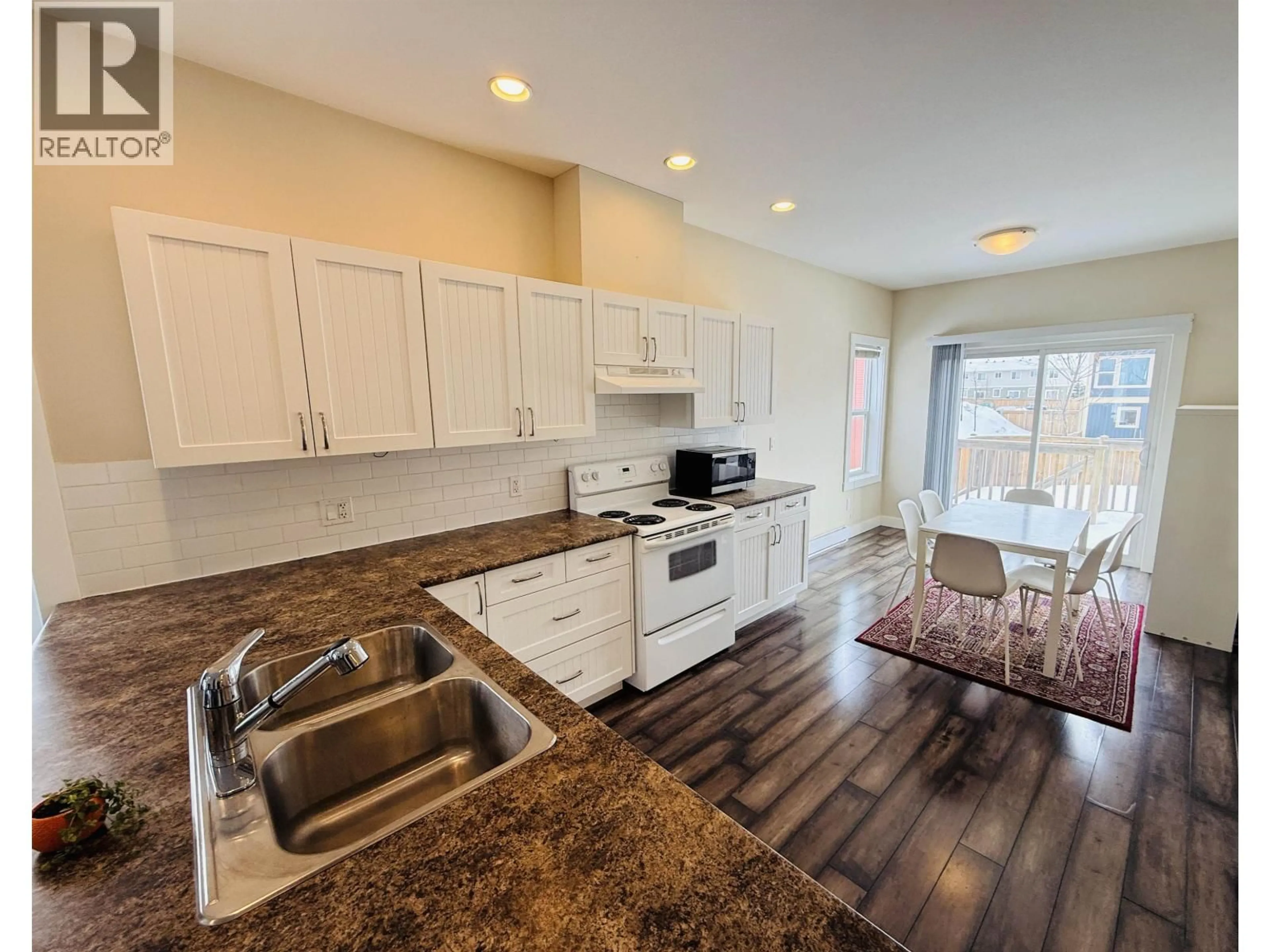 Open concept kitchen, unknown for 10217 112 STREET, Fort St. John British Columbia V1J0M2