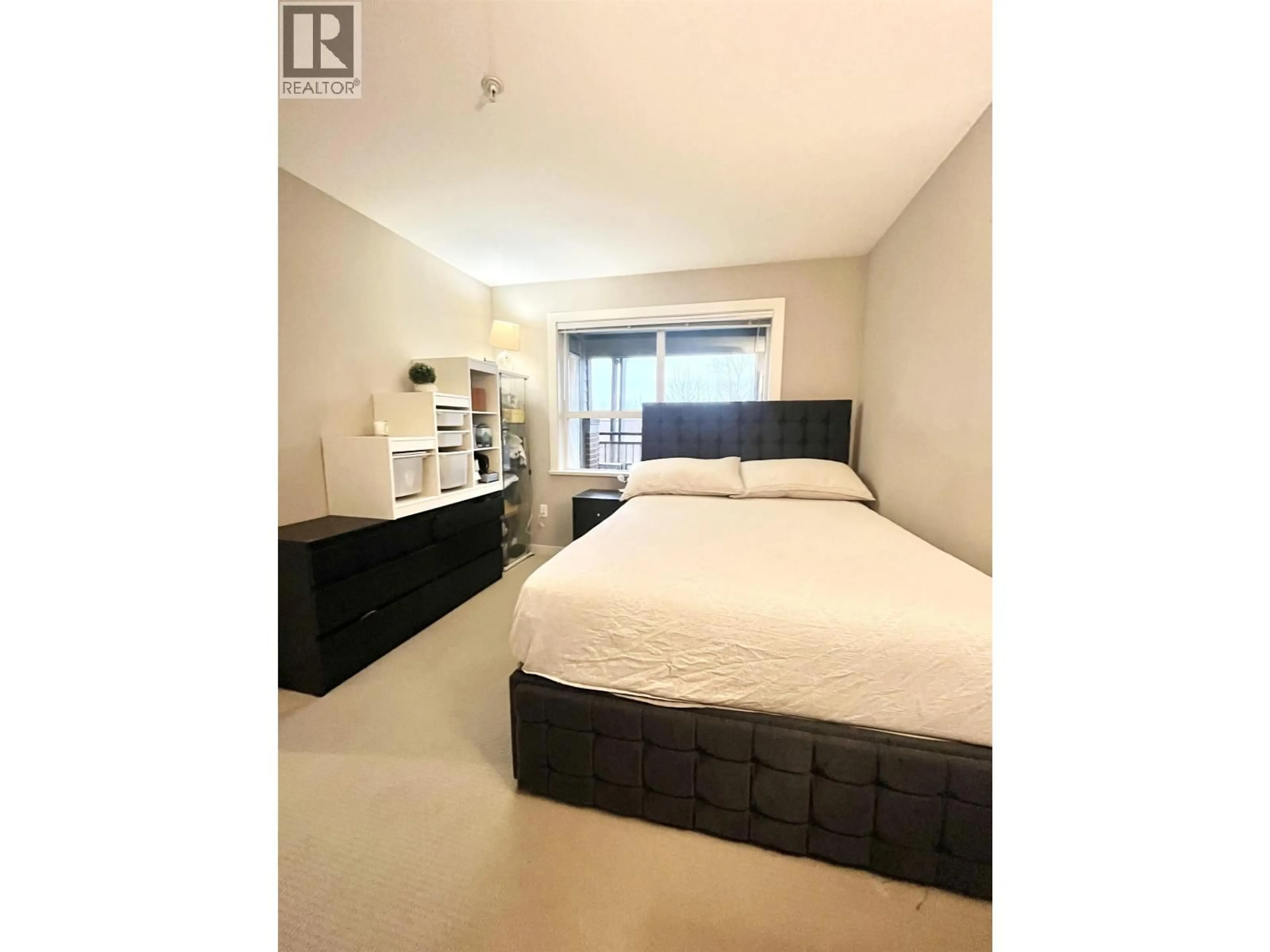 Bedroom with bed, wood/laminate floor for 314 - 5889 IRMIN STREET, Burnaby British Columbia V5J0C1